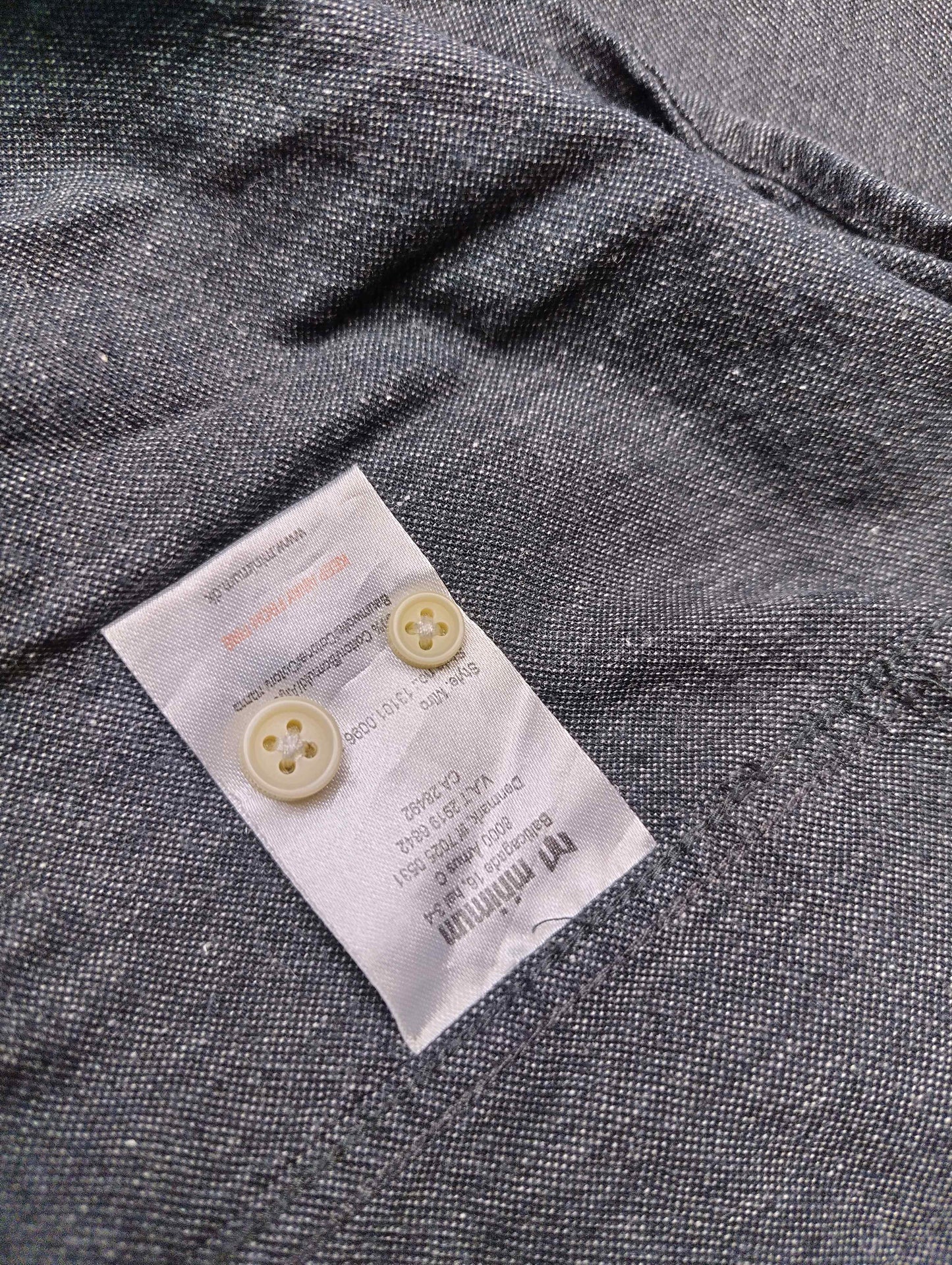 Fabric care label with buttons