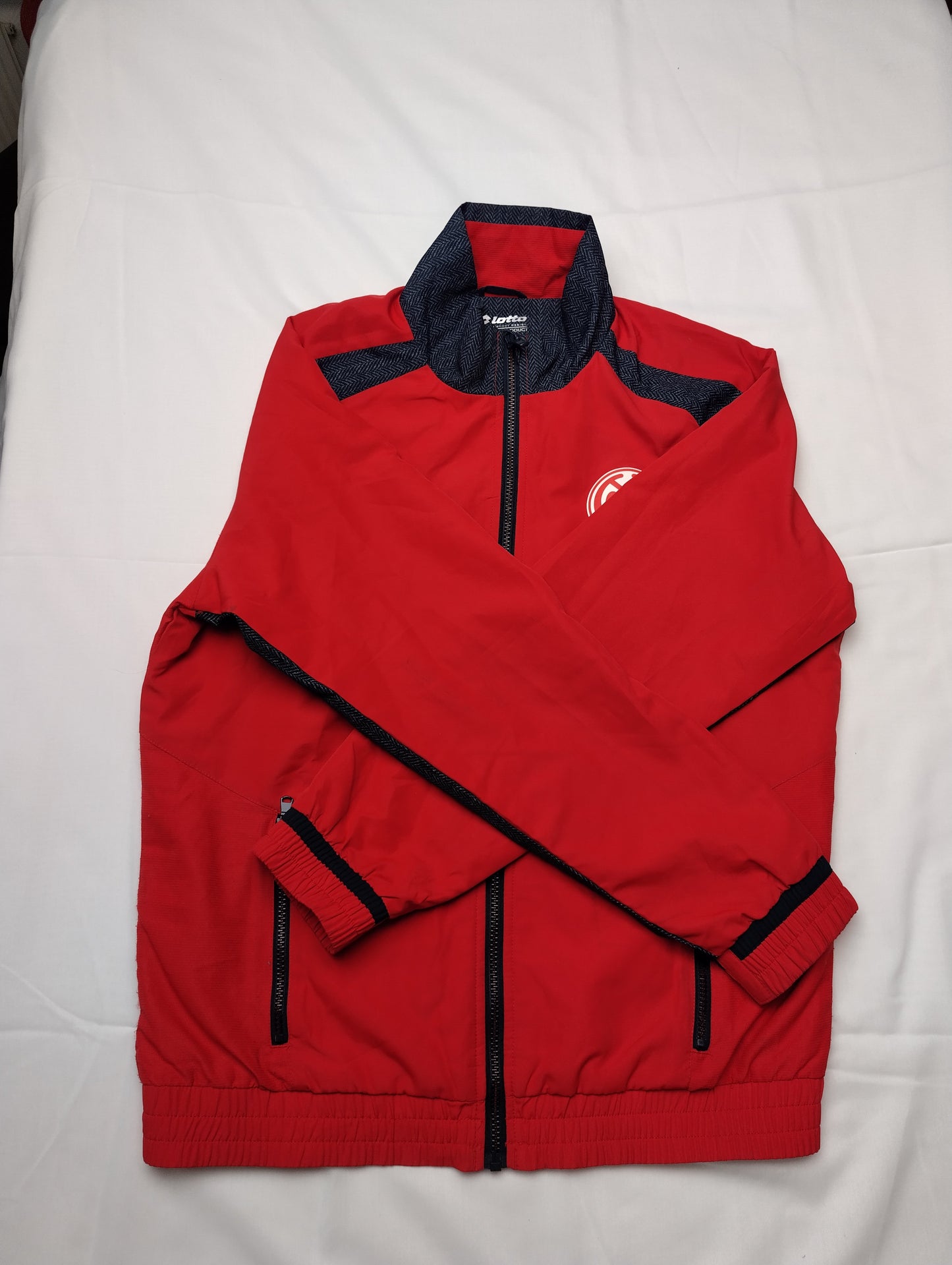Folded view of Lotto red sports jacket
