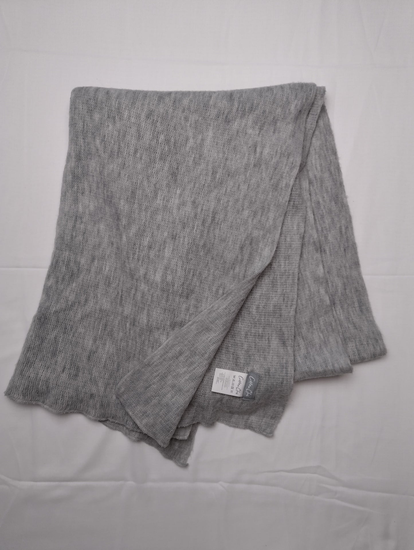 Flat lay of a grey scarf