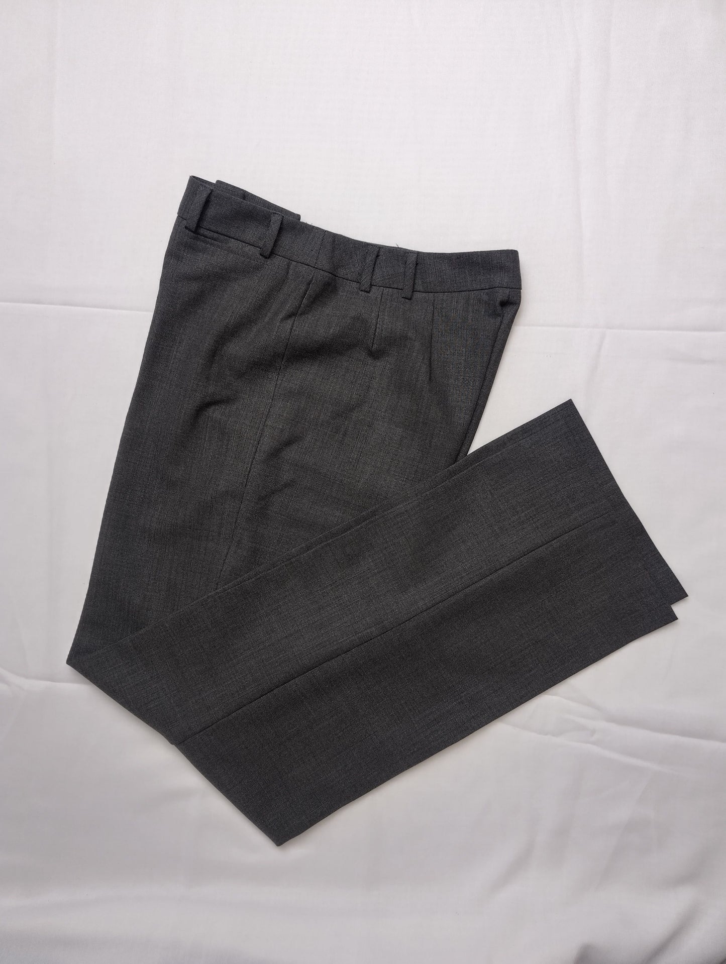 Folded view of grey dress pants