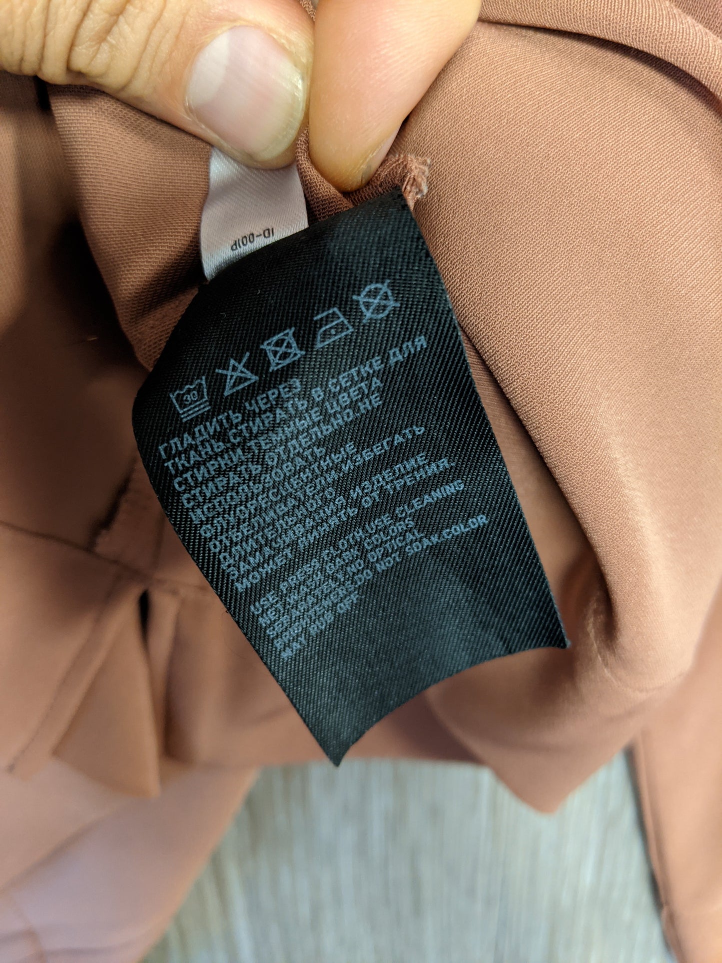 Brown V-neck top inside label