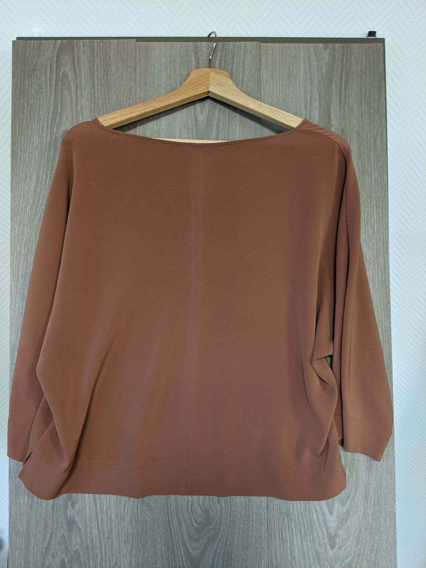 Brown V-neck top back view