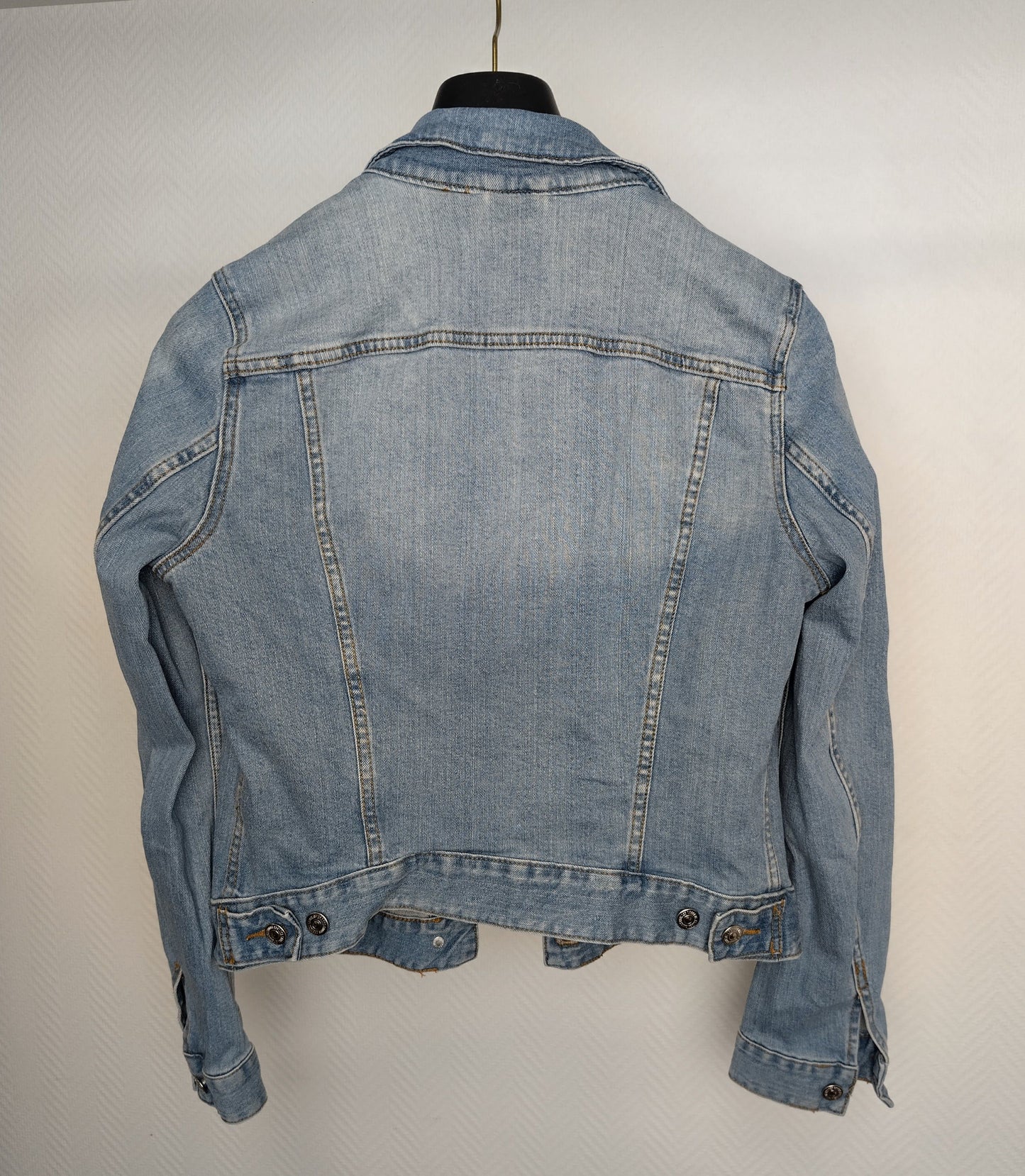 Back view of light blue denim jacket