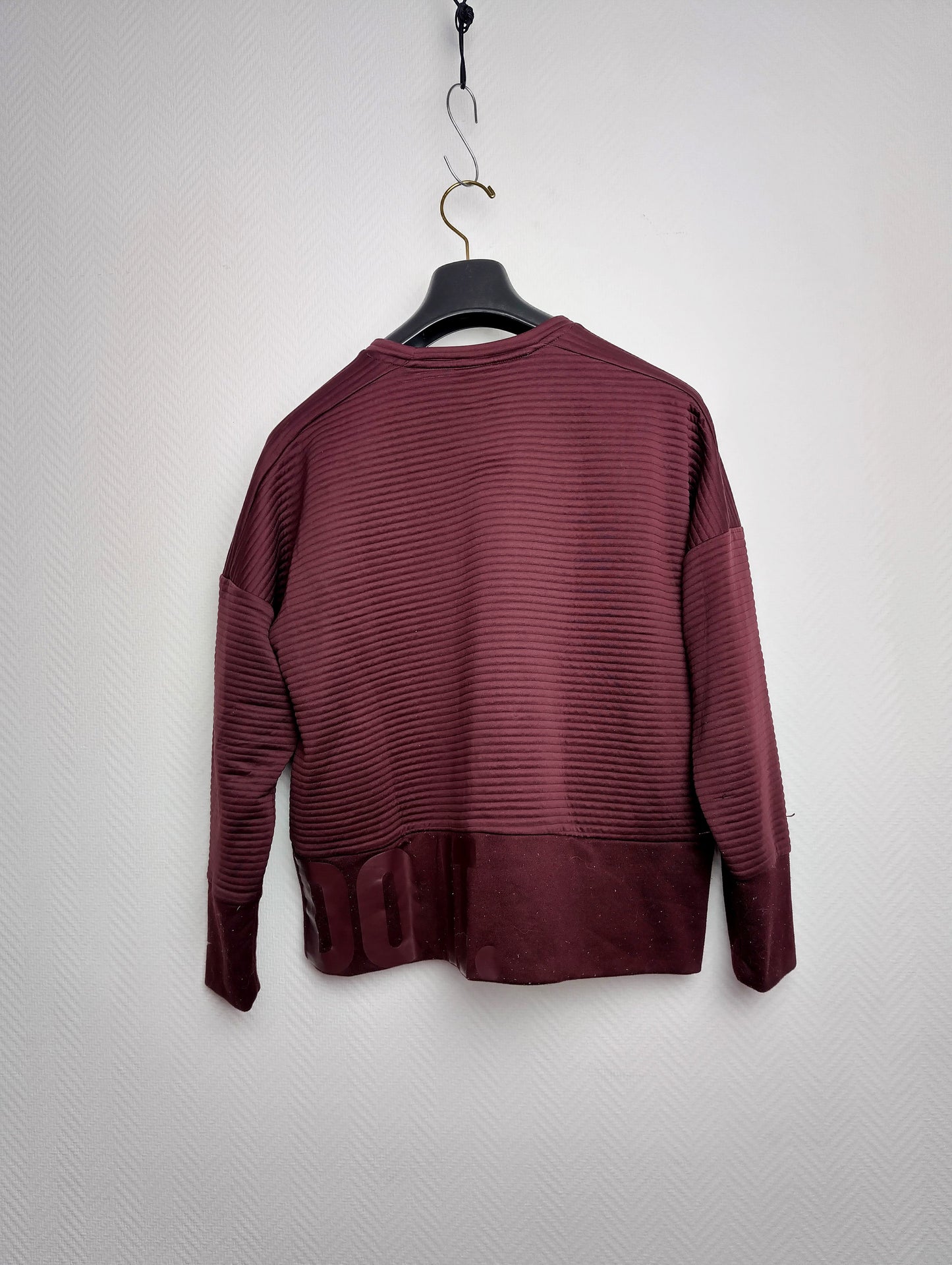Back view of burgundy Nike Dri-FIT sweatshirt