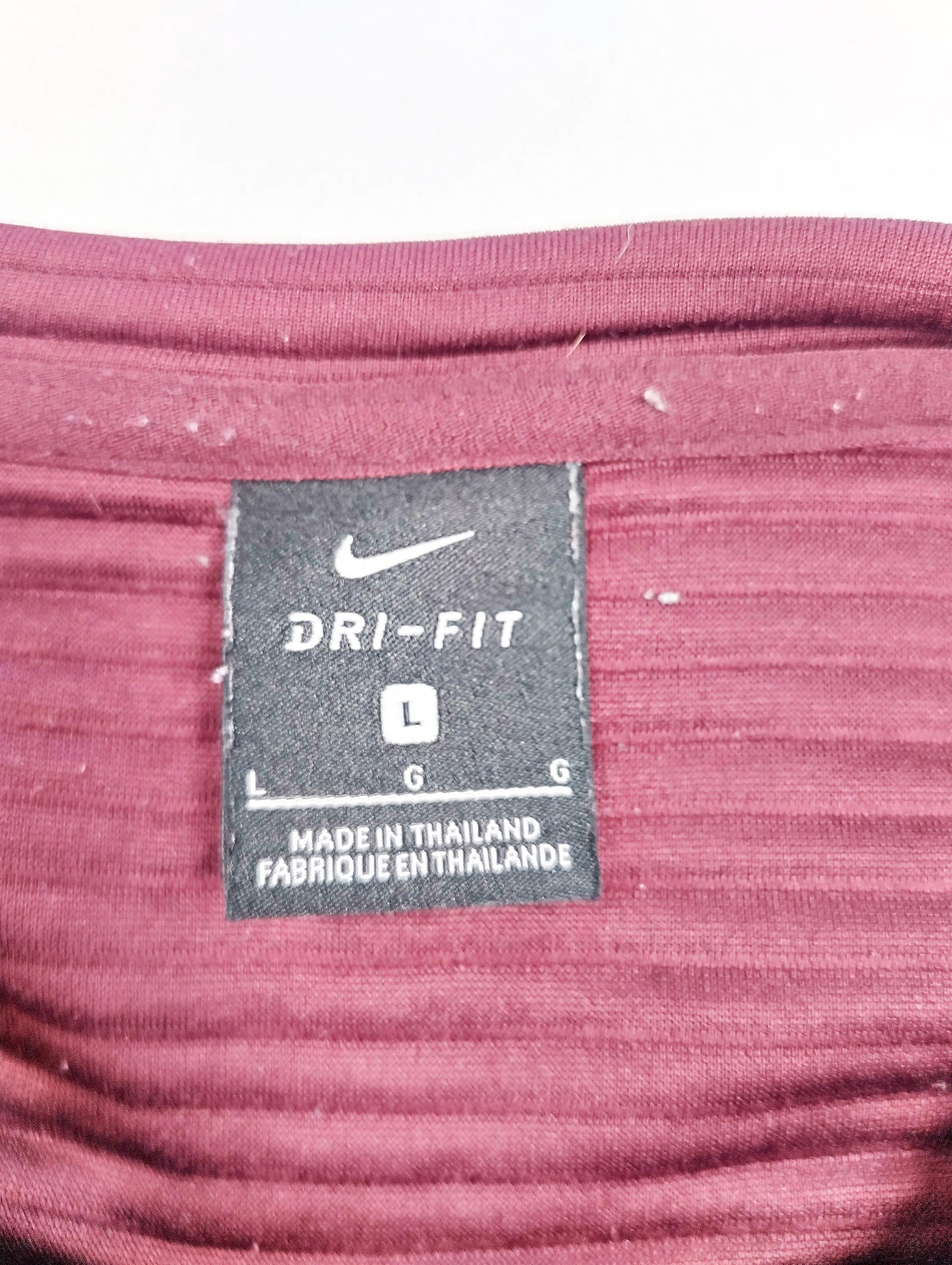 Nike Dri-FIT label showing size large