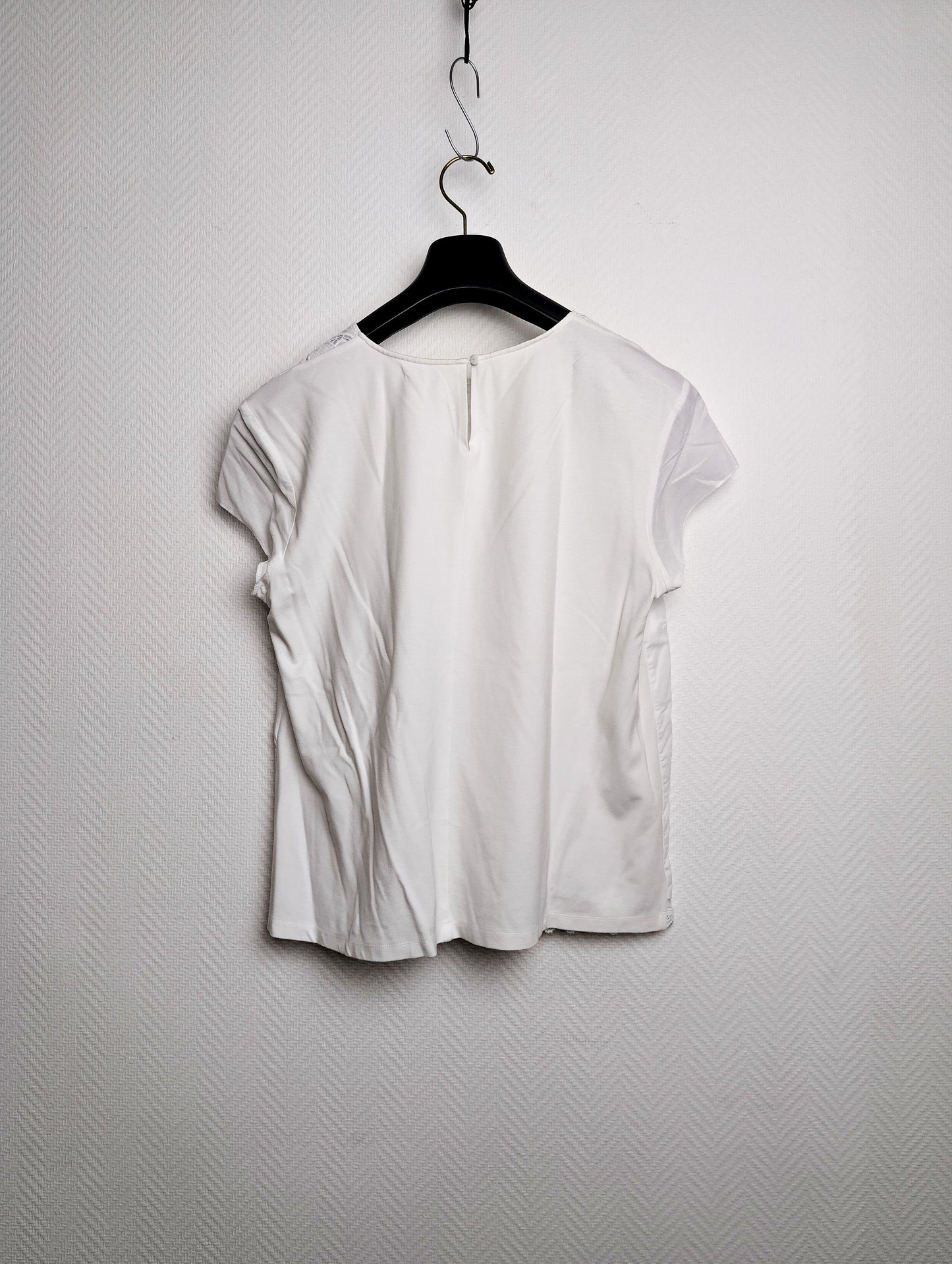 Front view of the white embroidered blouse