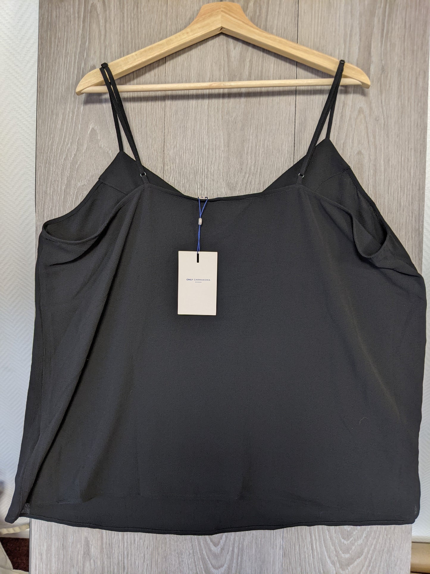 Black camisole on hanger