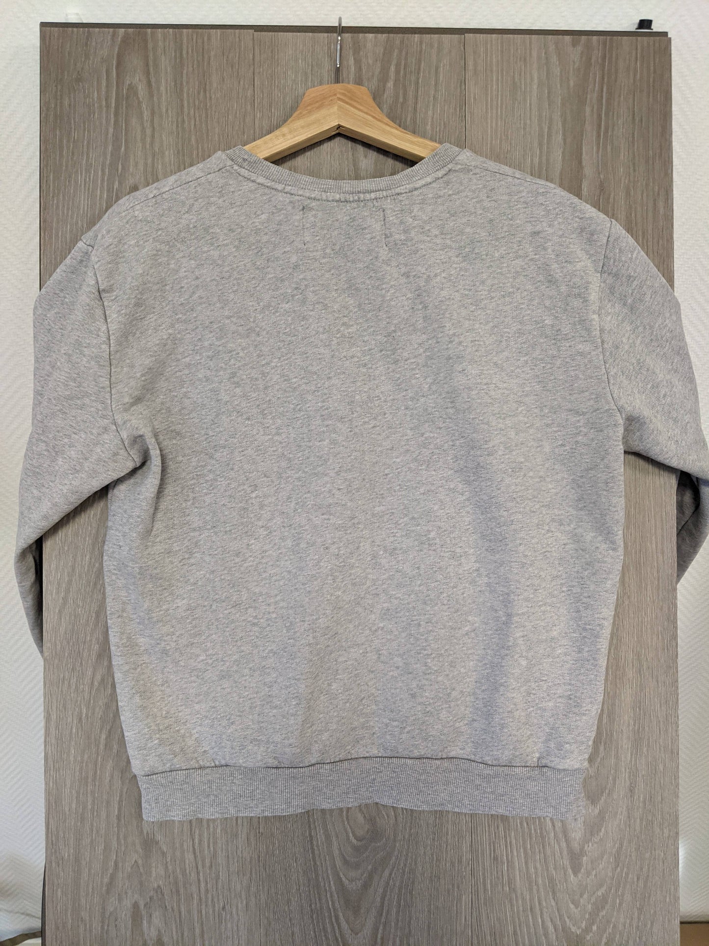 Back view of grey sweater