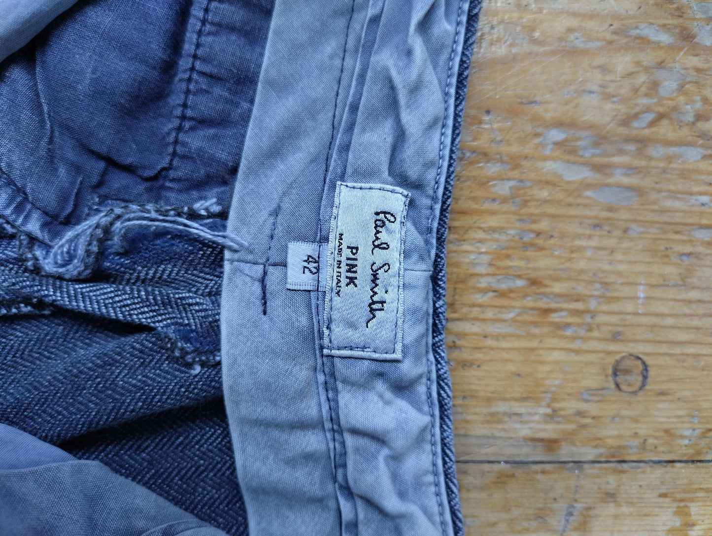 Close-up of Paul Smith Pink label inside trousers
