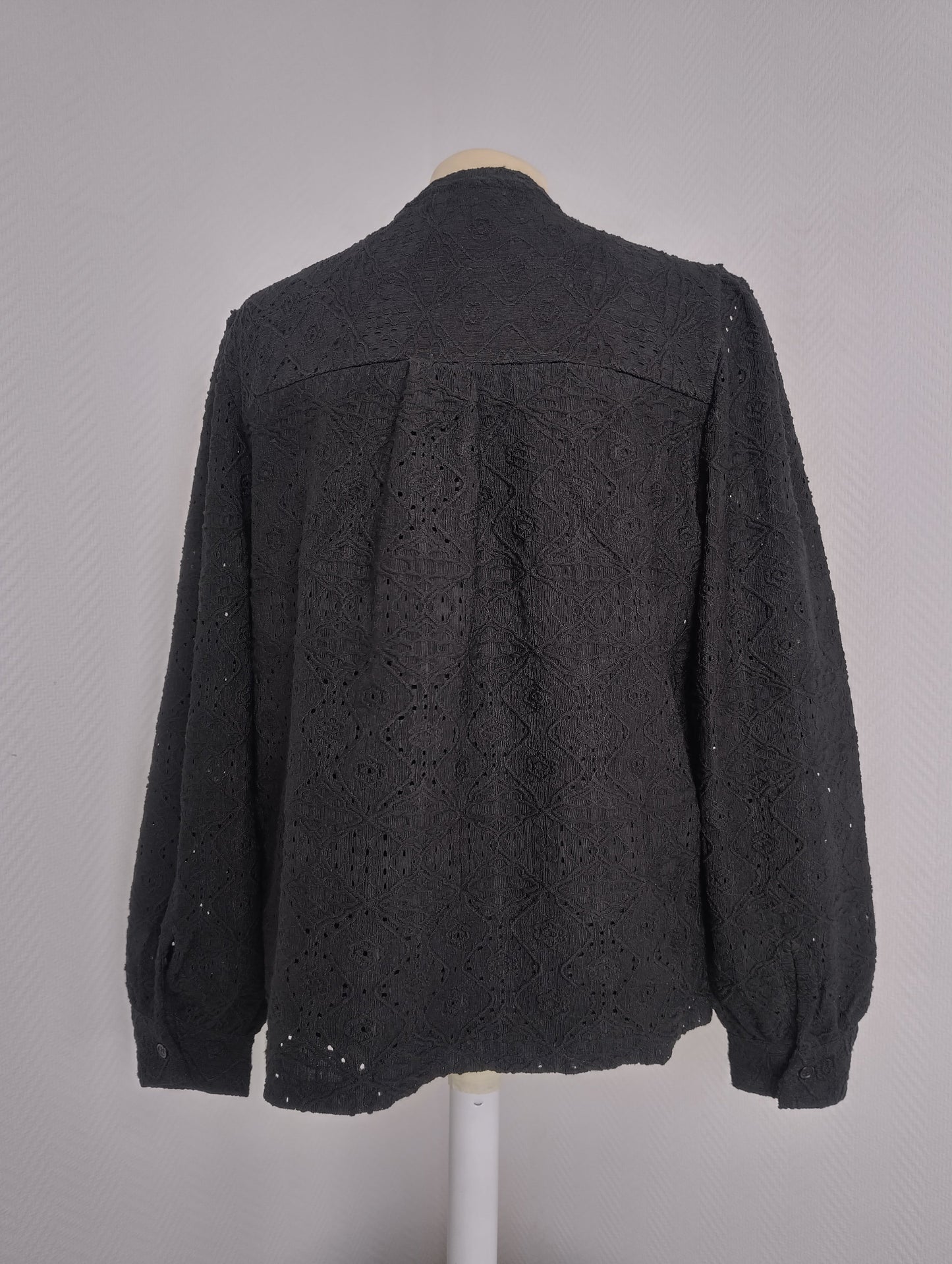 Back view of black embroidered long-sleeve shirt