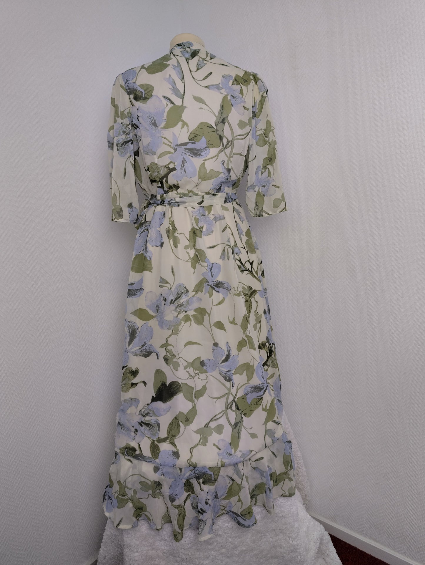 Floral wrap dress on mannequin from the back