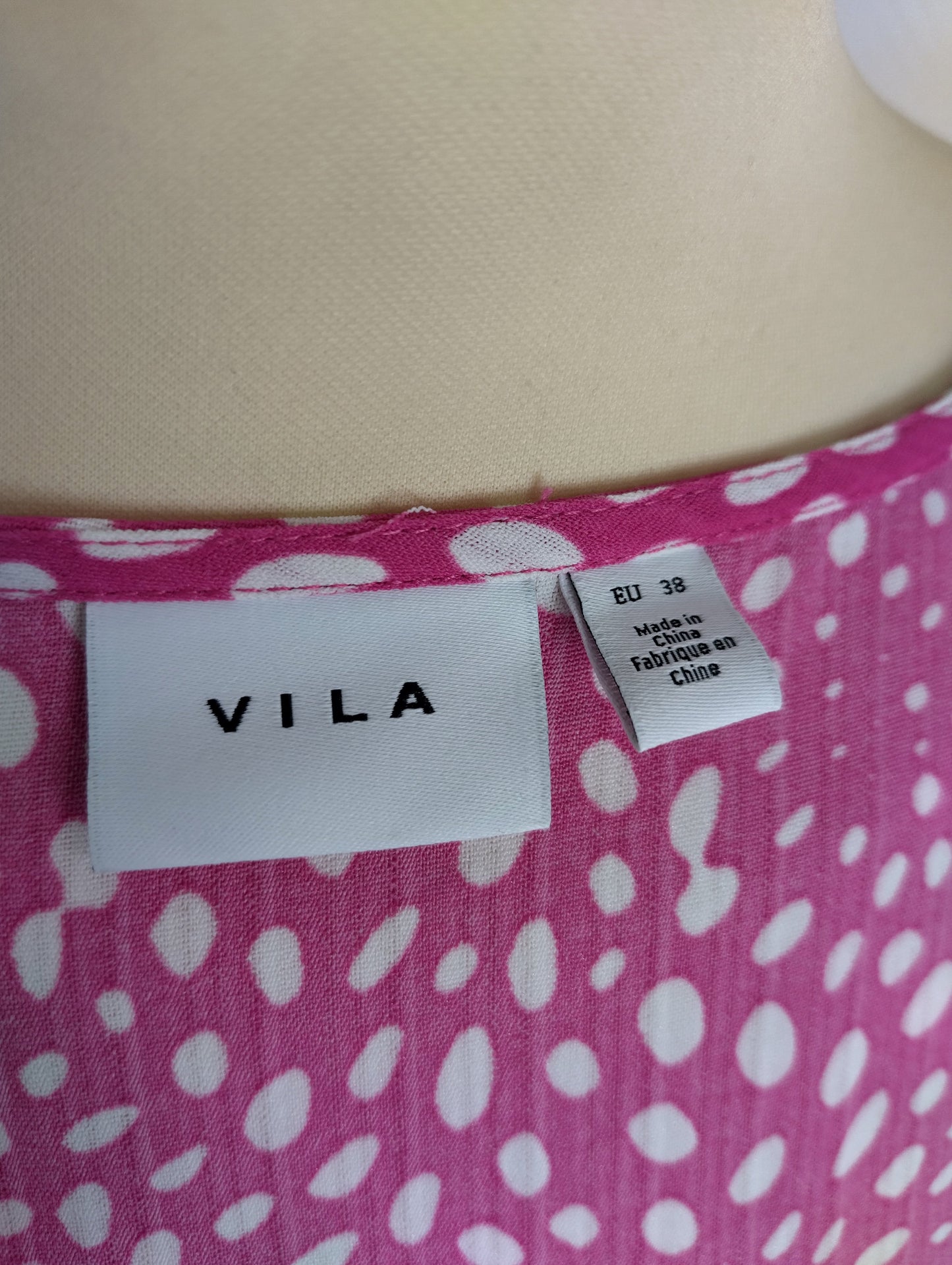 Brand tag of Vila on the dress showing EU size 38