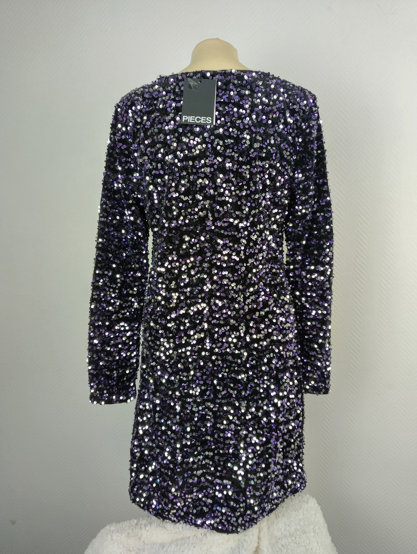 Back view of black and purple sequin dress