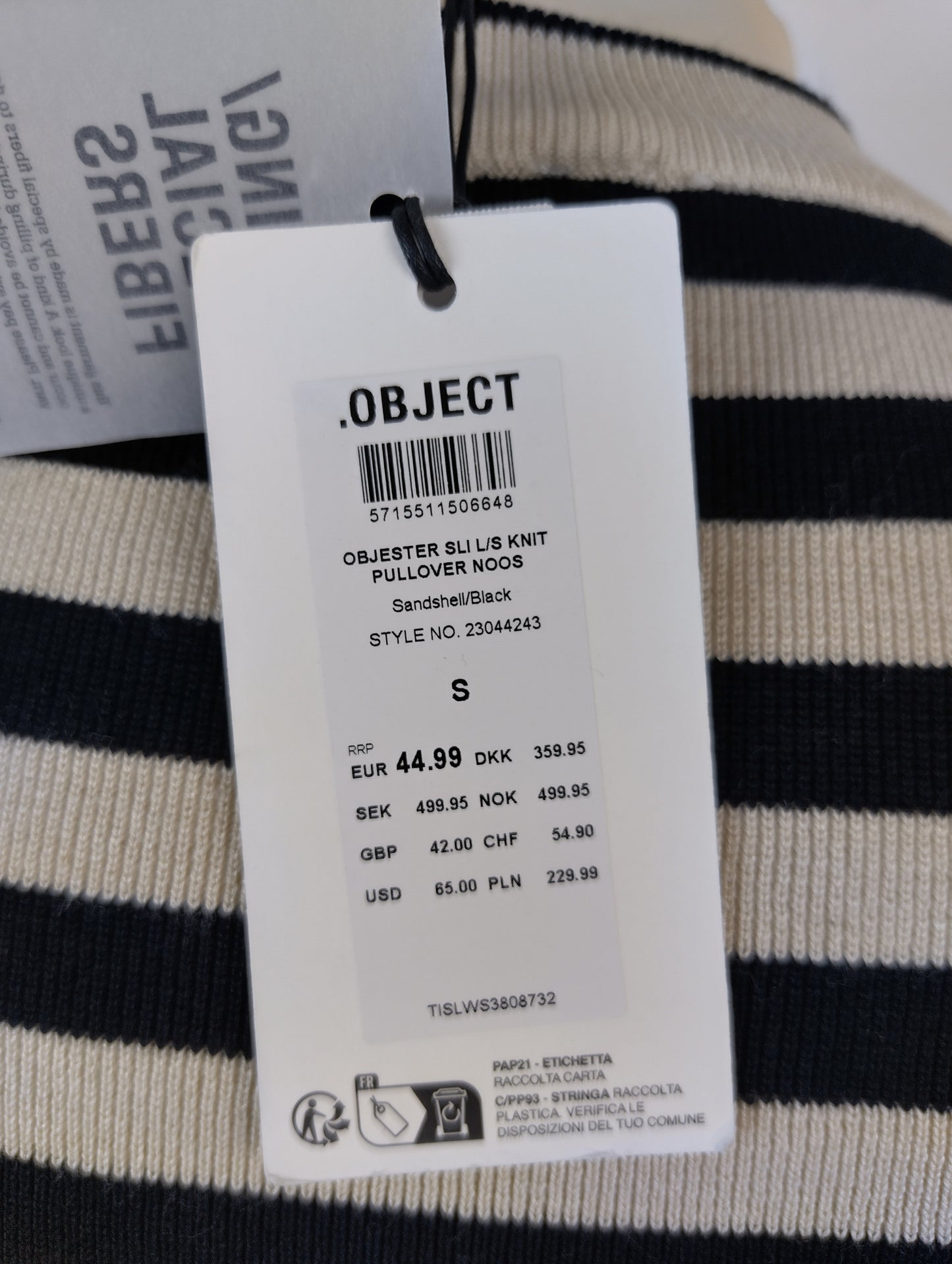 Close-up of tag on striped knit pullover