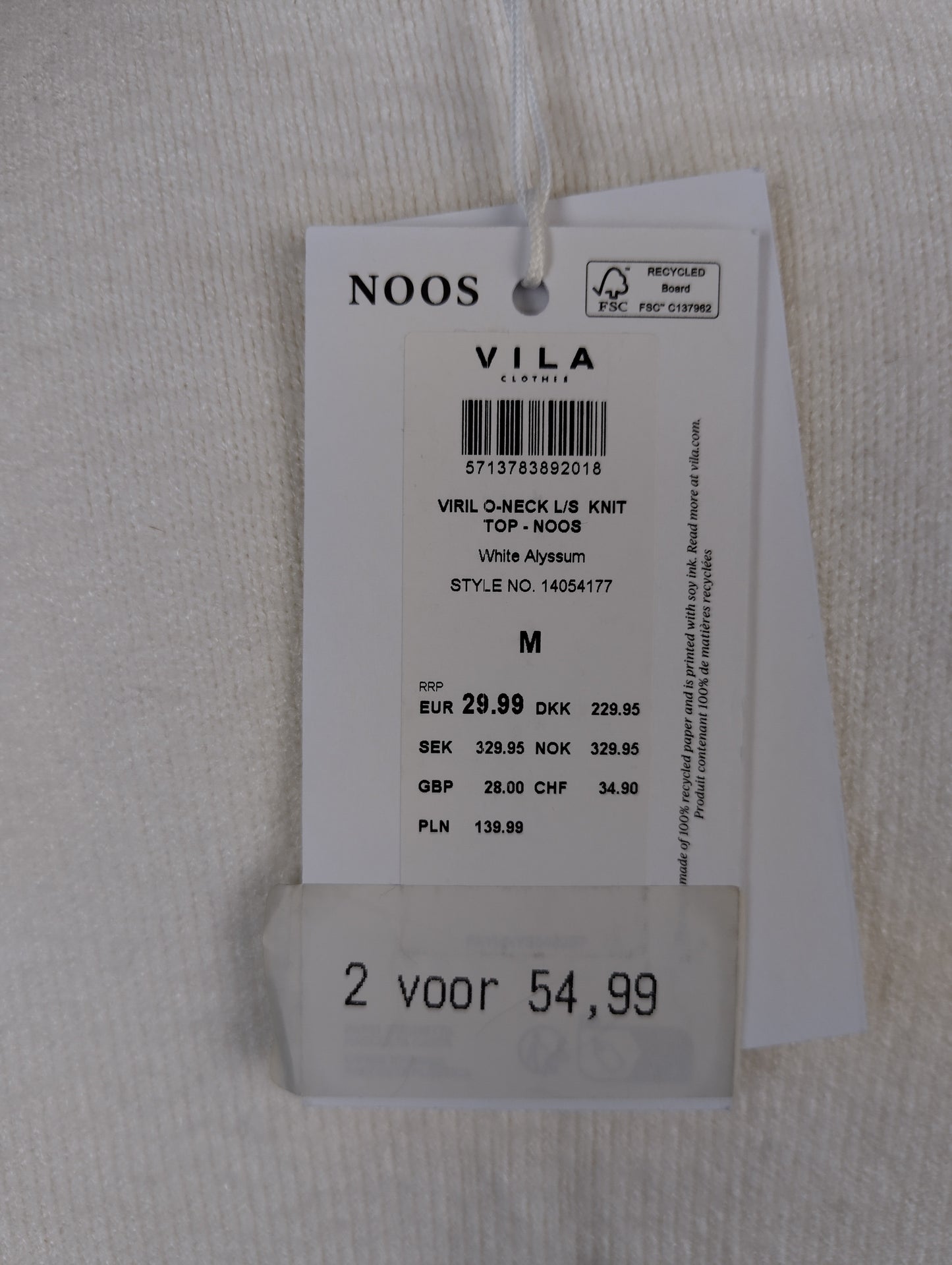 Close-up of tag showing details and pricing