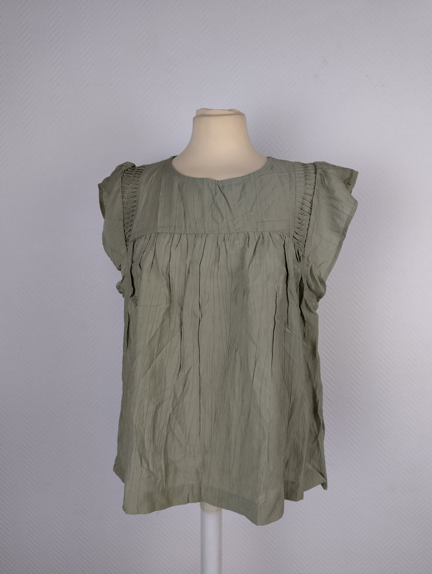 Full front view of olive green crinkle blouse