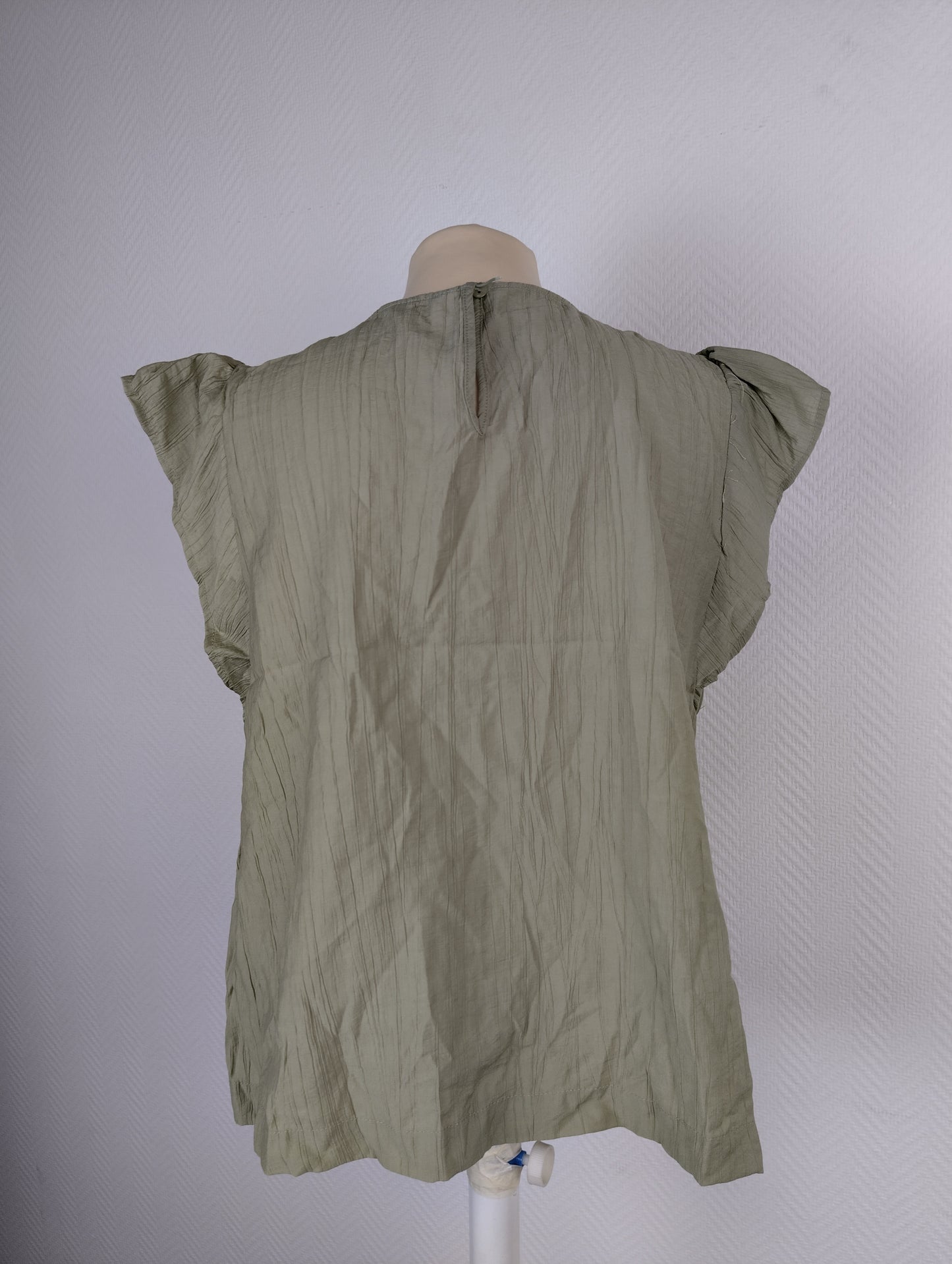 Back view of olive green crinkle blouse