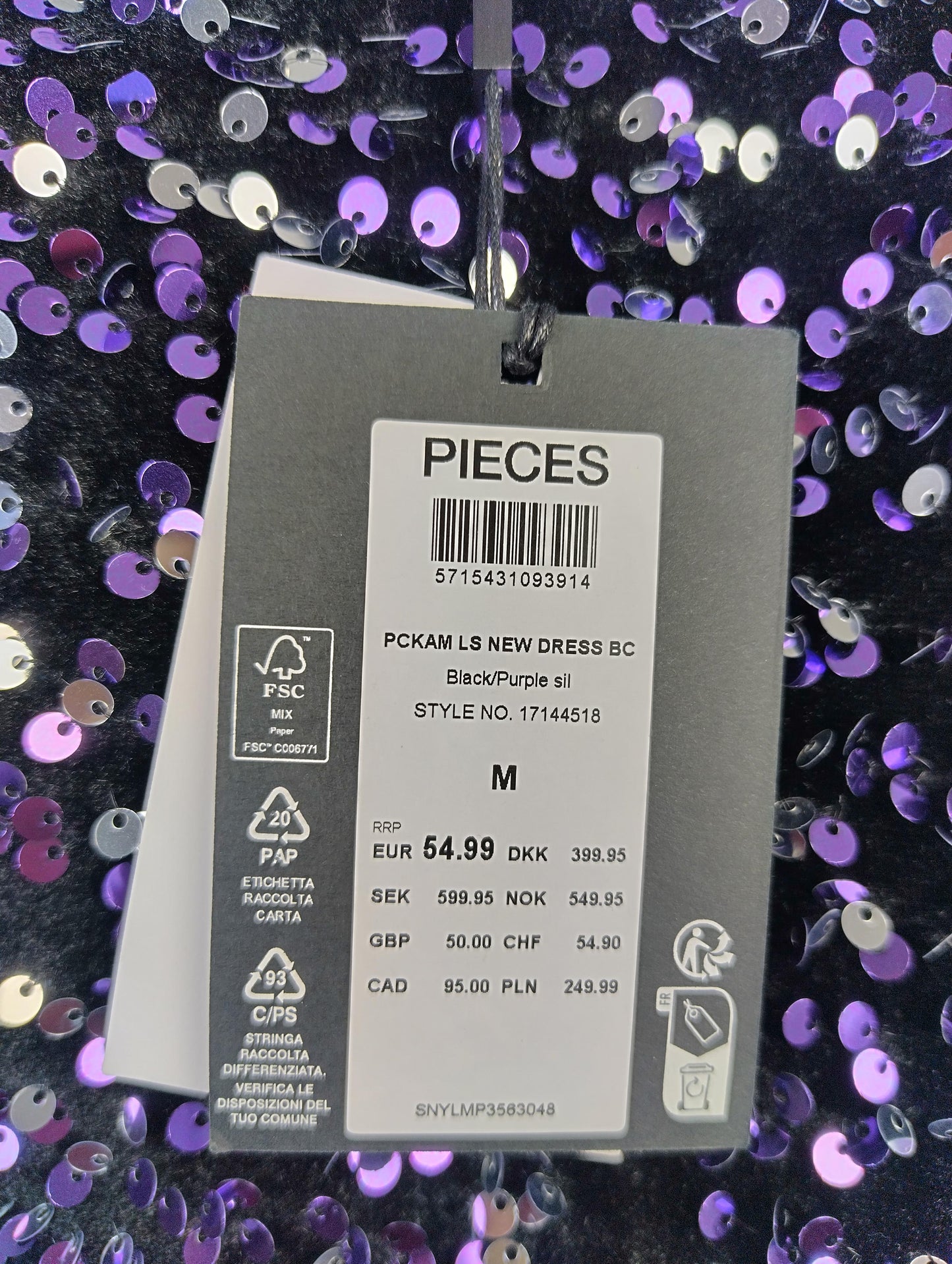 Close-up of tag showing size and price of the dress