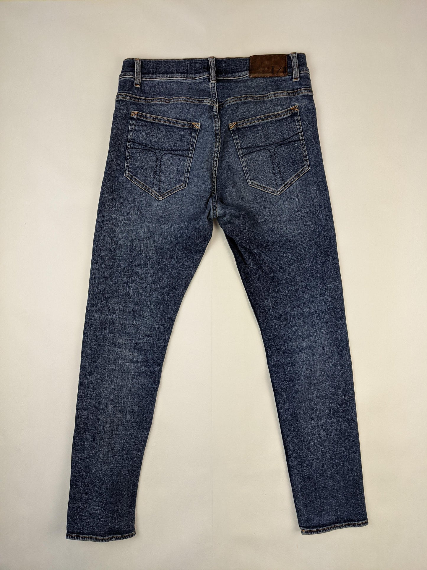 Back view of Tiger of Sweden blue denim jeans