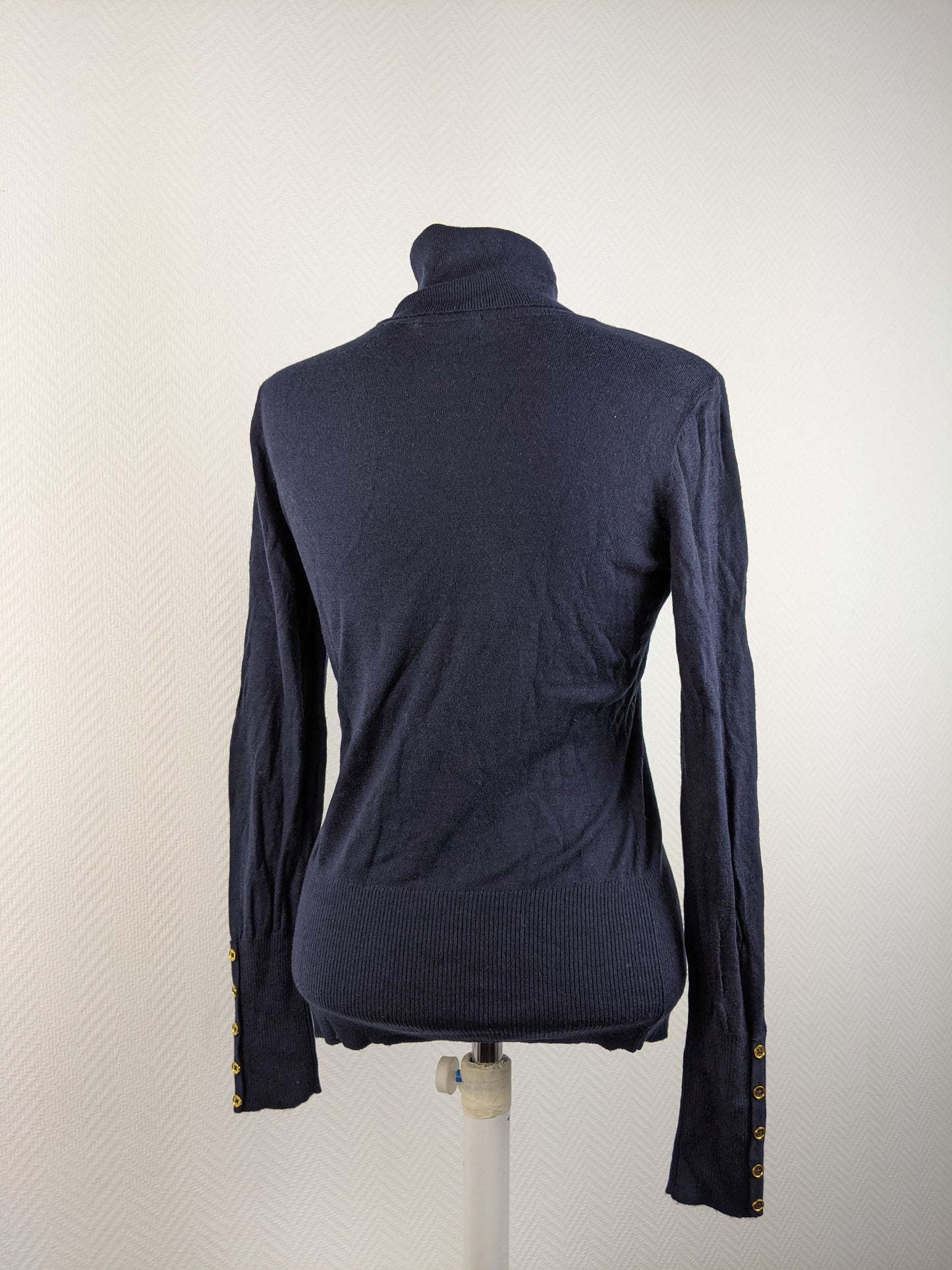 Back view of black turtleneck sweater