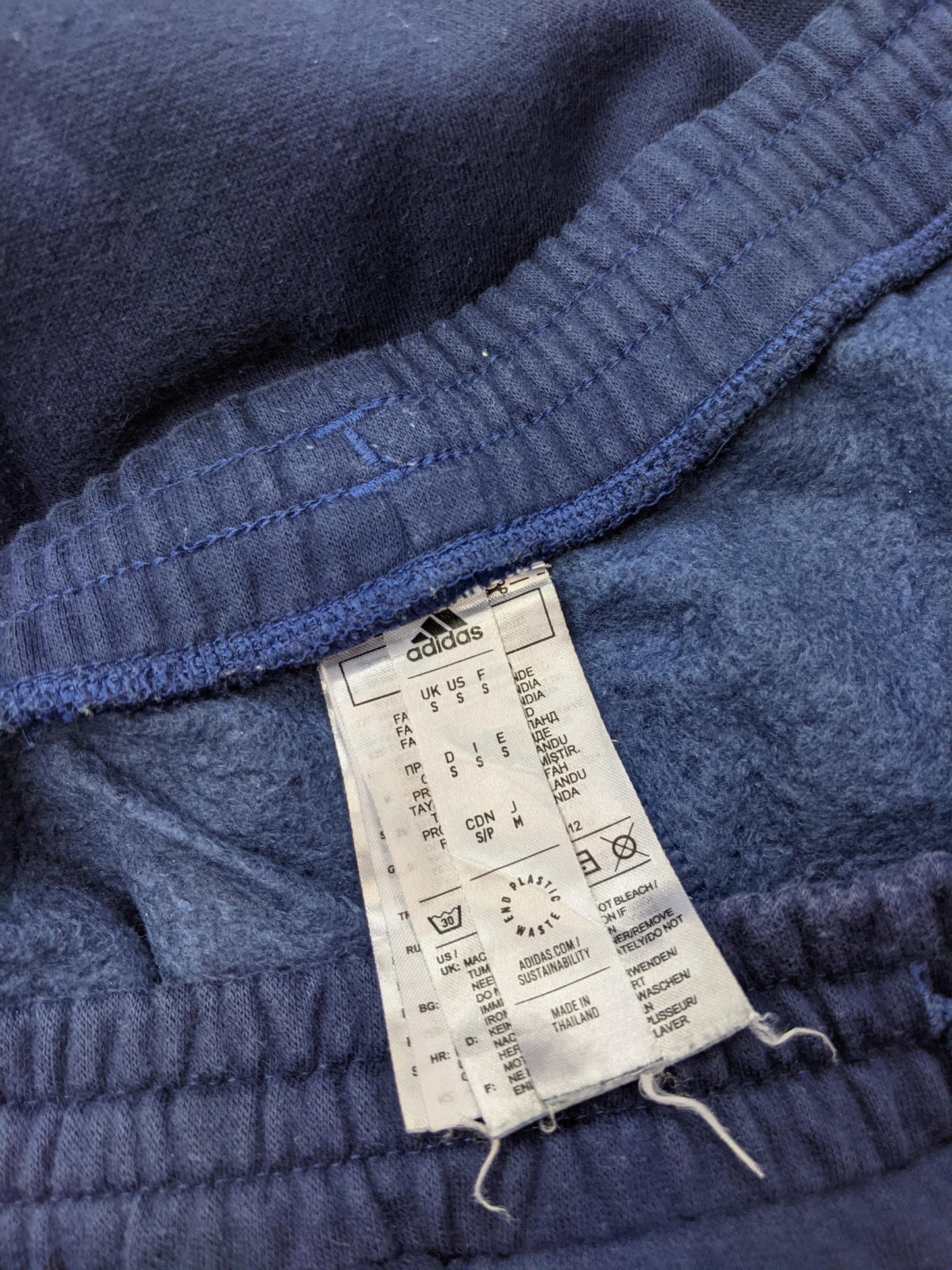 Close-up of label on Adidas sweatpants
