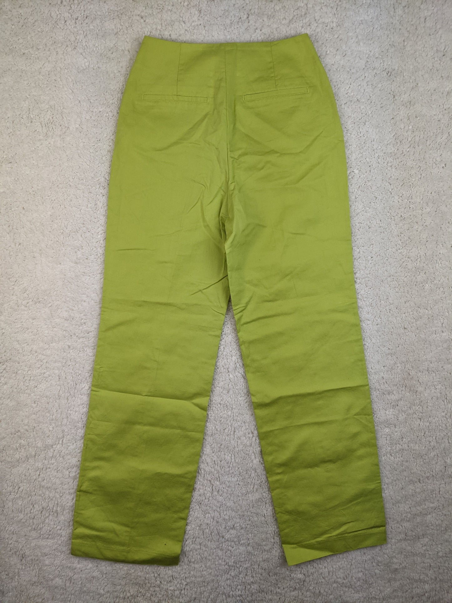 Back view of Zara lime green high-waisted pants