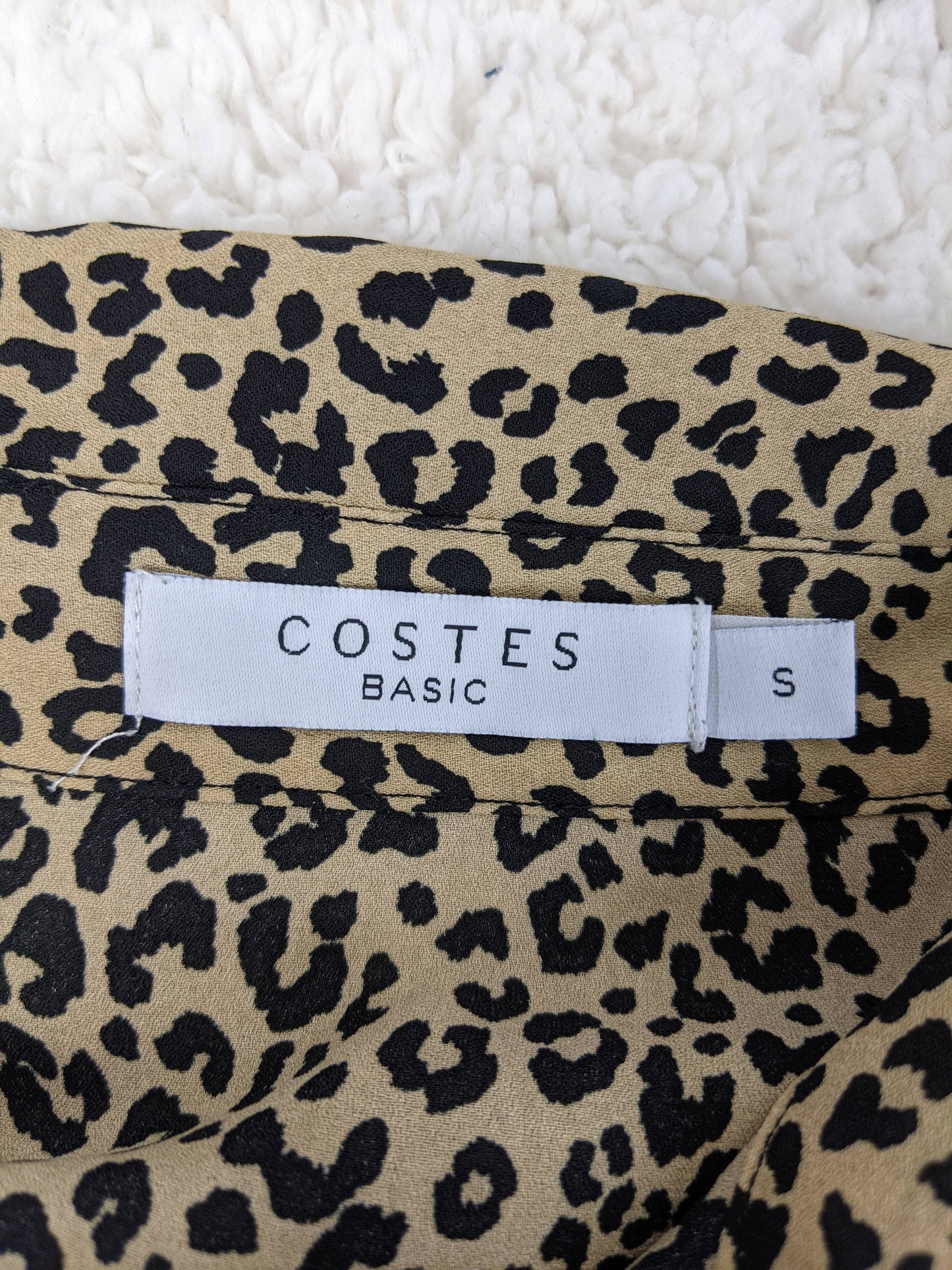 Costes label on garment showing 'Basic' and size 'S'