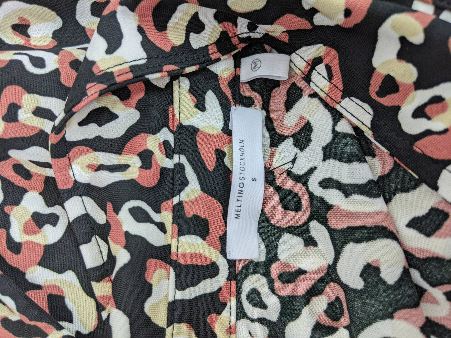 Close-up of label on leopard print blouse