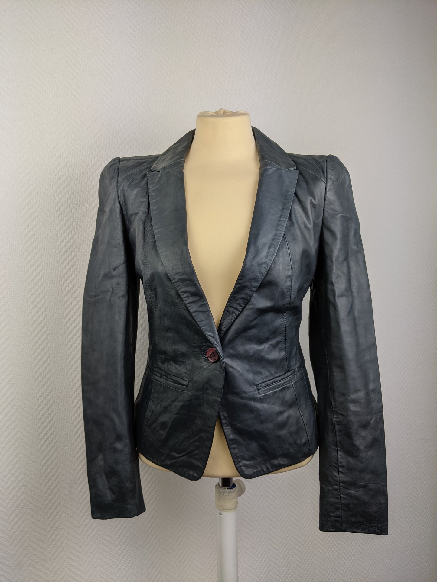 Front view of black leather blazer