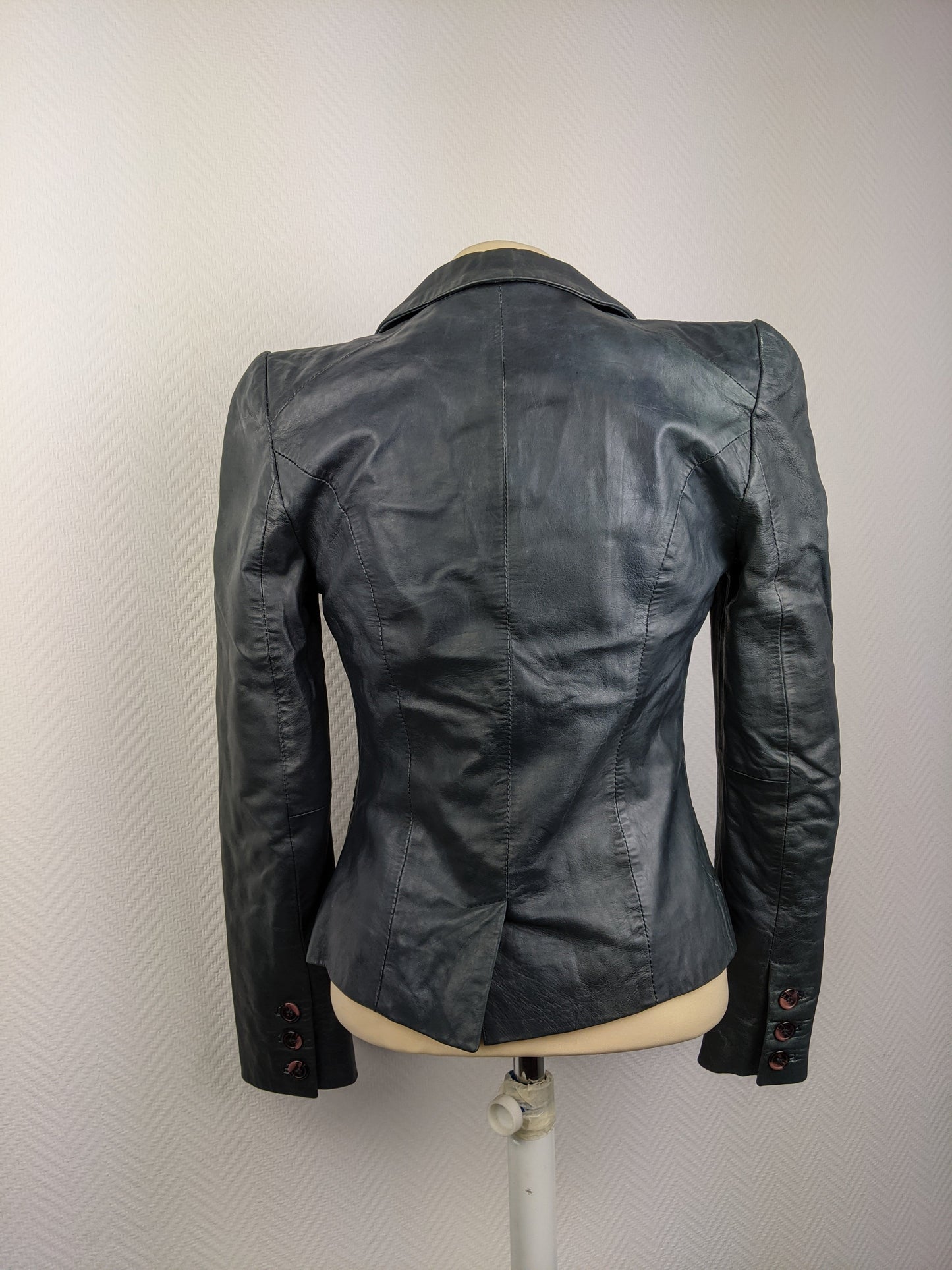 Back view of black leather blazer