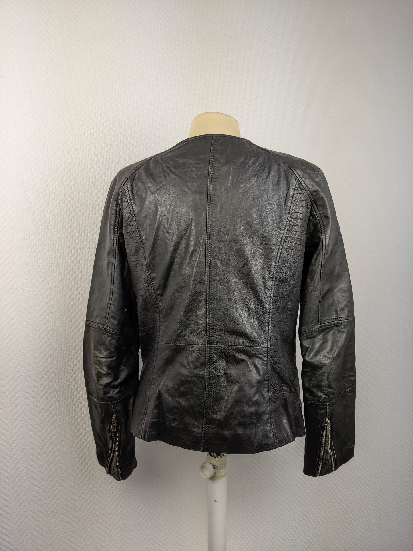 Back view of black leather jacket
