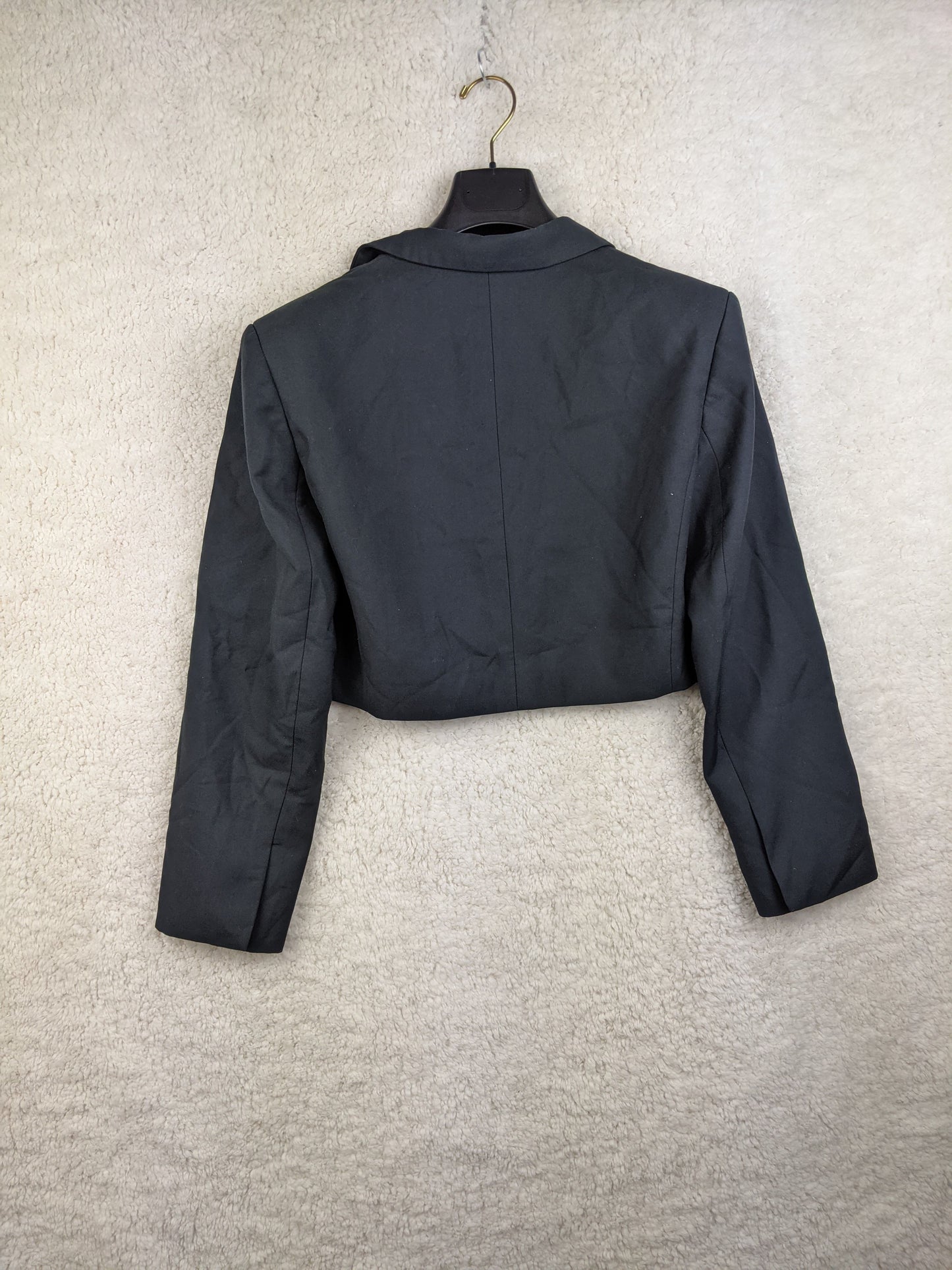 Back view of a black cropped blazer