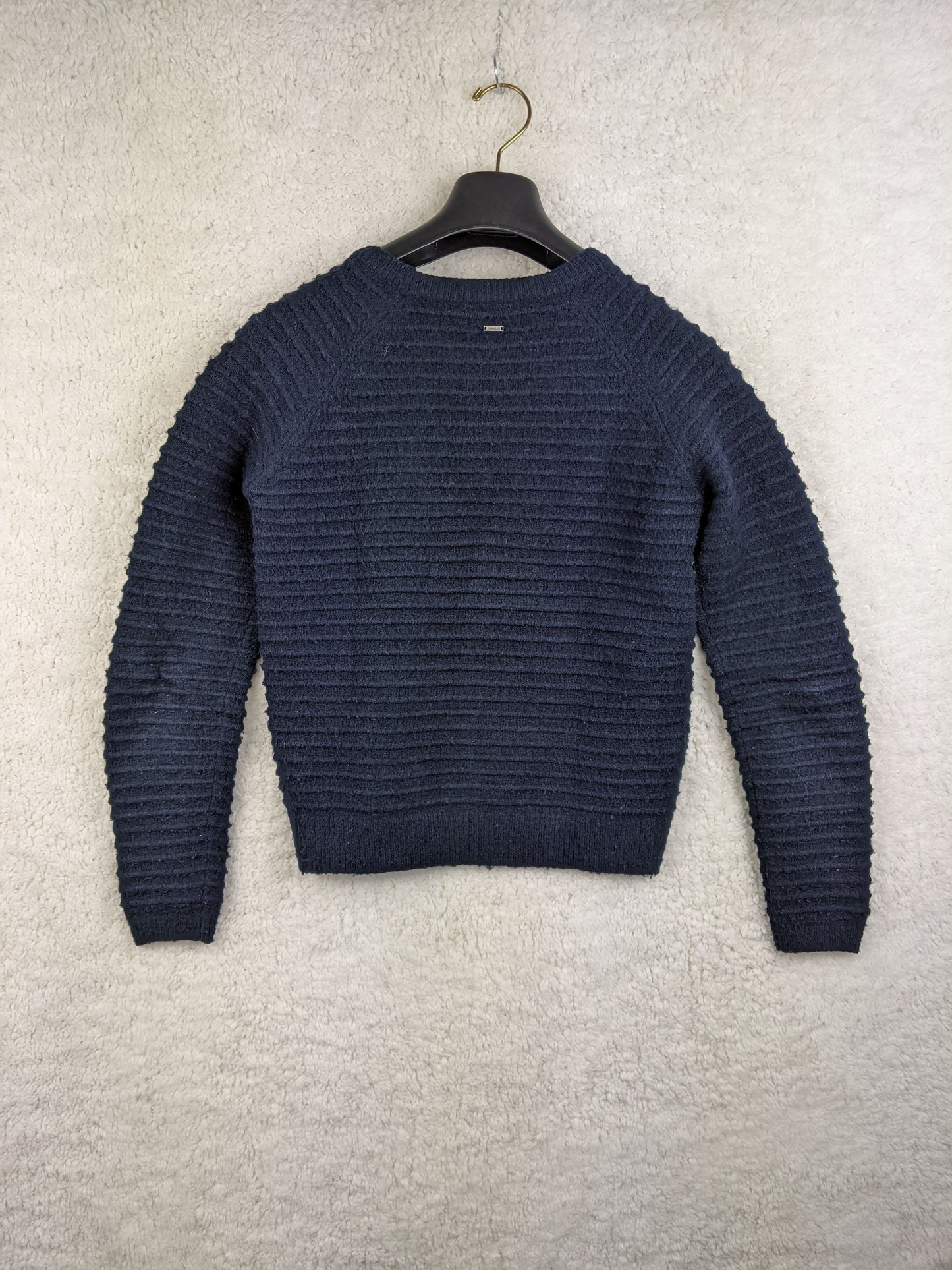 Back view of the navy textured sweater