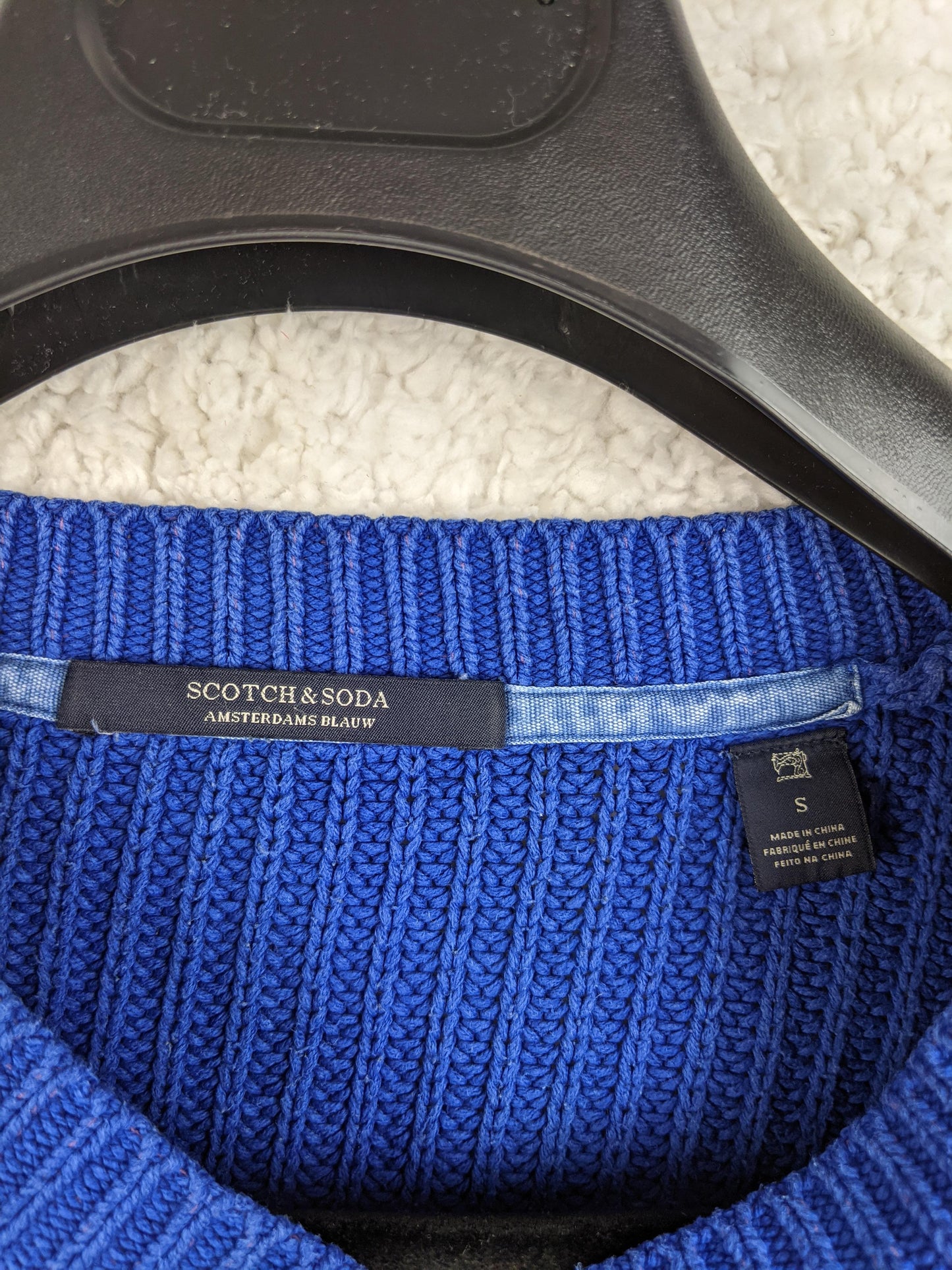 Close-up of Scotch & Soda label on sweater