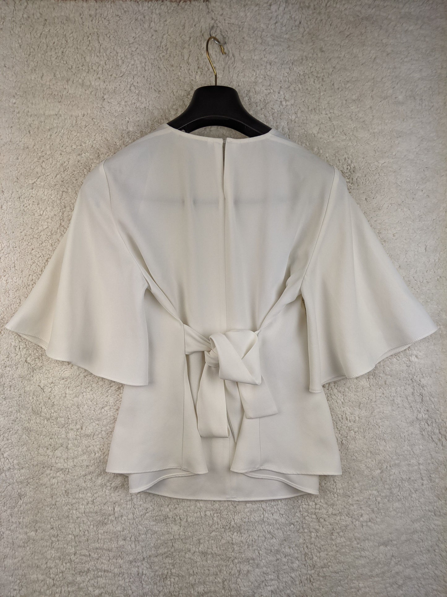 Rear view of white Zara blouse showing tie detail