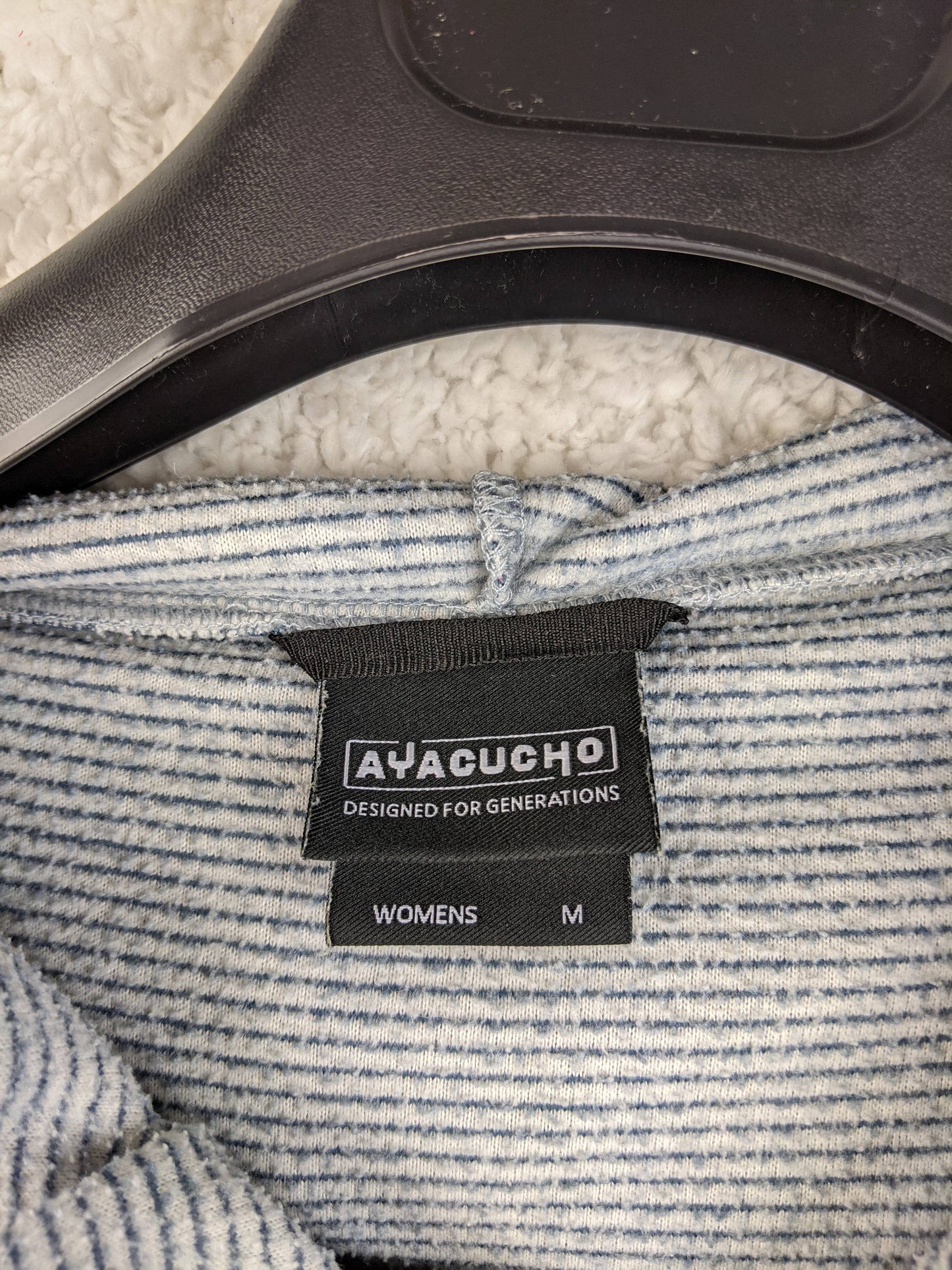 Close-up of Ayacucho brand label on hoodie