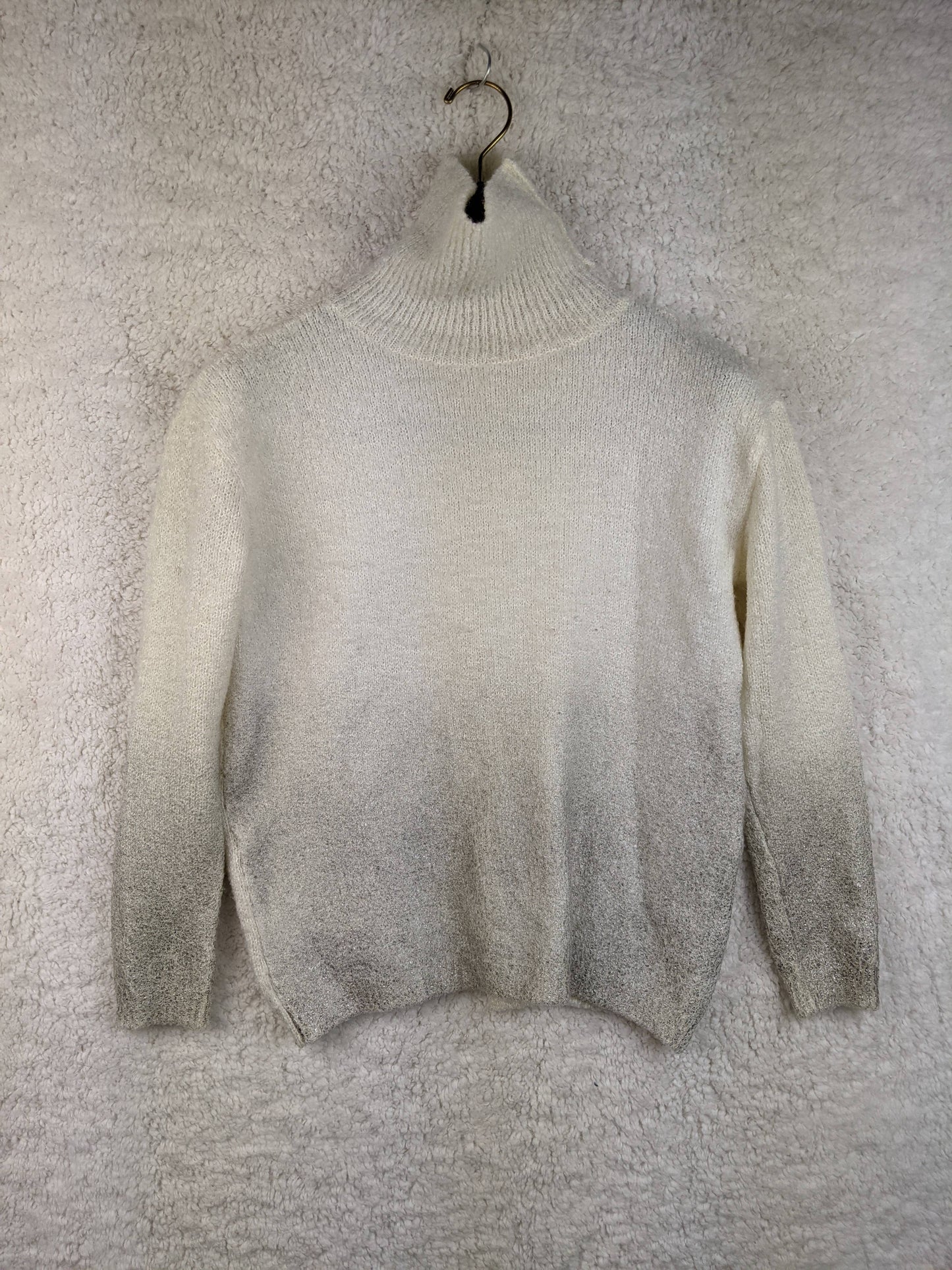 Front view of cream high neck sweater