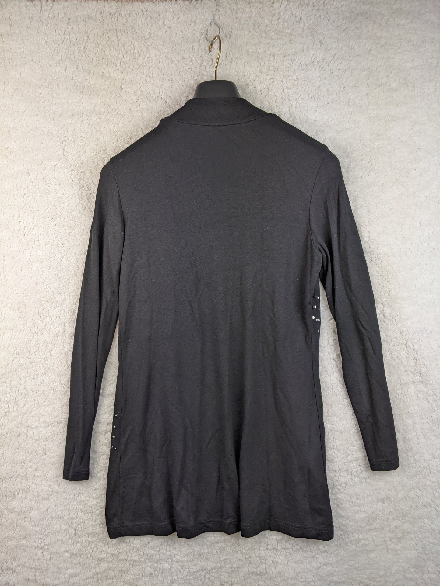 Back view of black open front cardigan