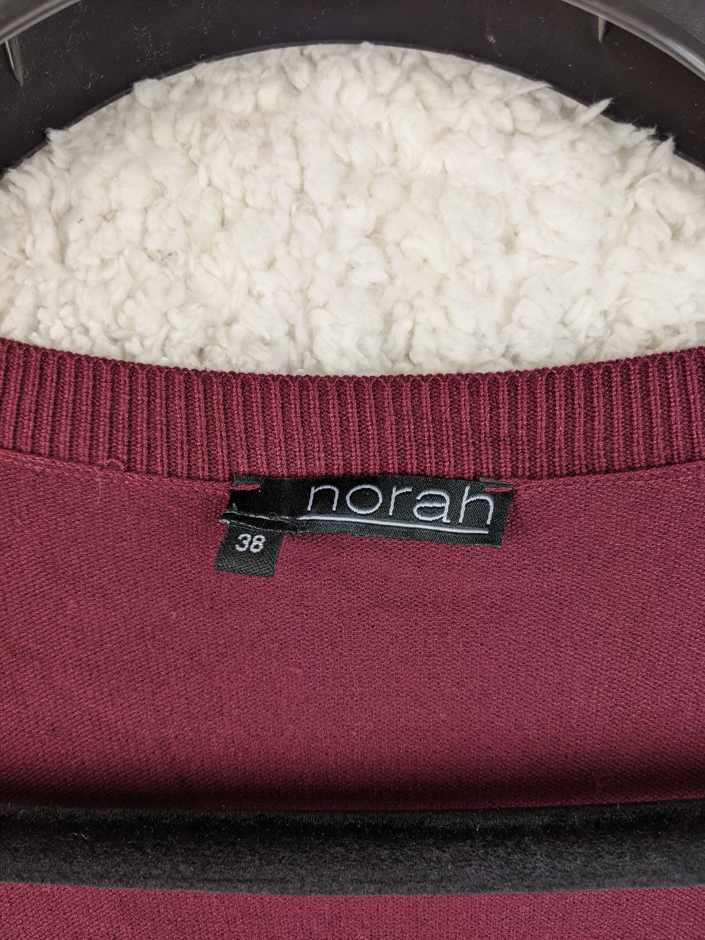 Brand label of Norah burgundy long cardigan