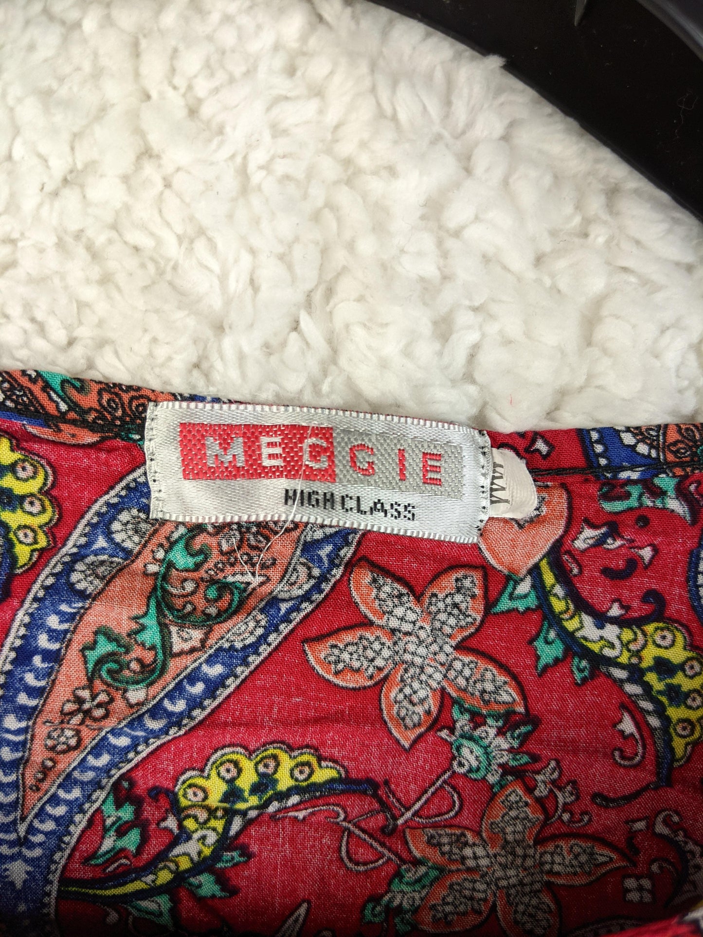 Close-up of Meggie brand label on blouse