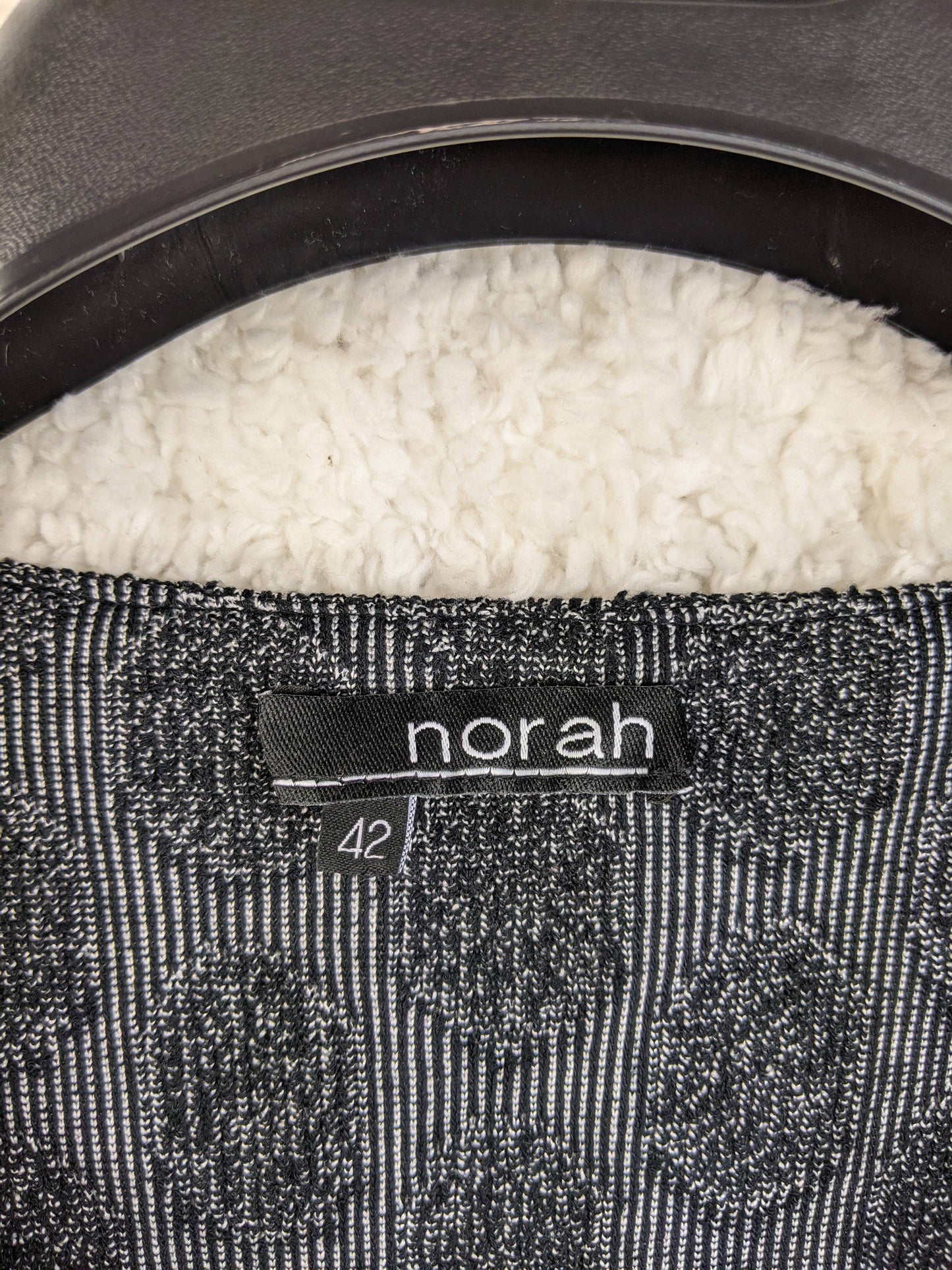 Close-up of Norah dress label showing size 42