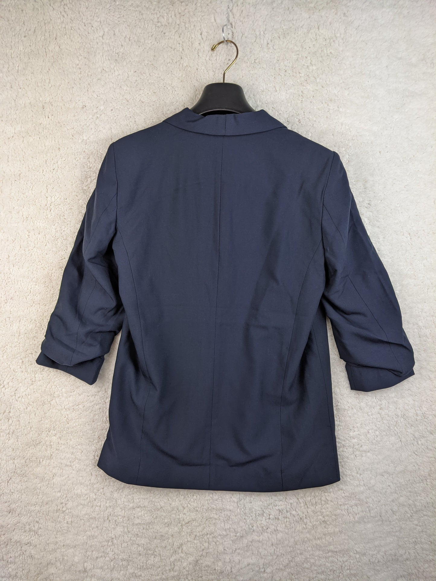 Navy blue blazer back view