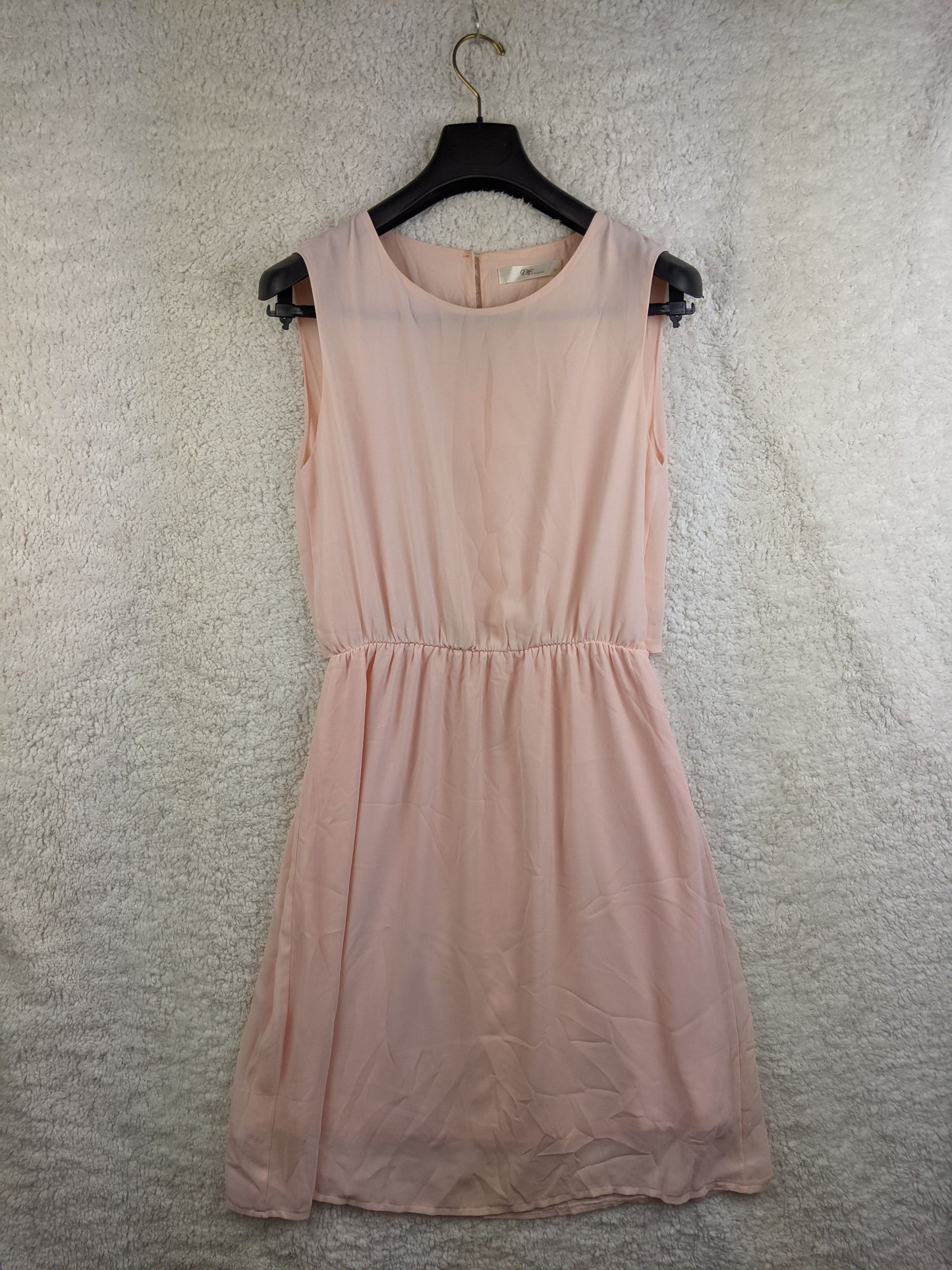 Front view of light pink sleeveless dress