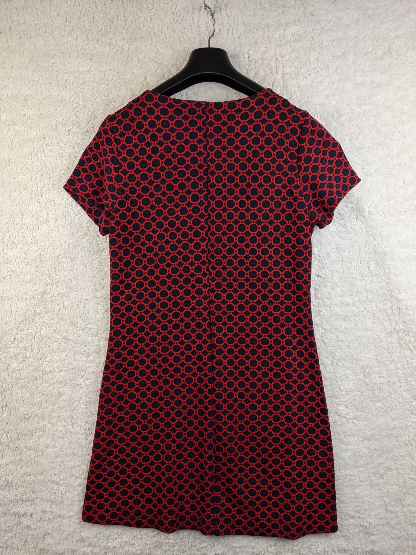 Back view of red and black patterned dress