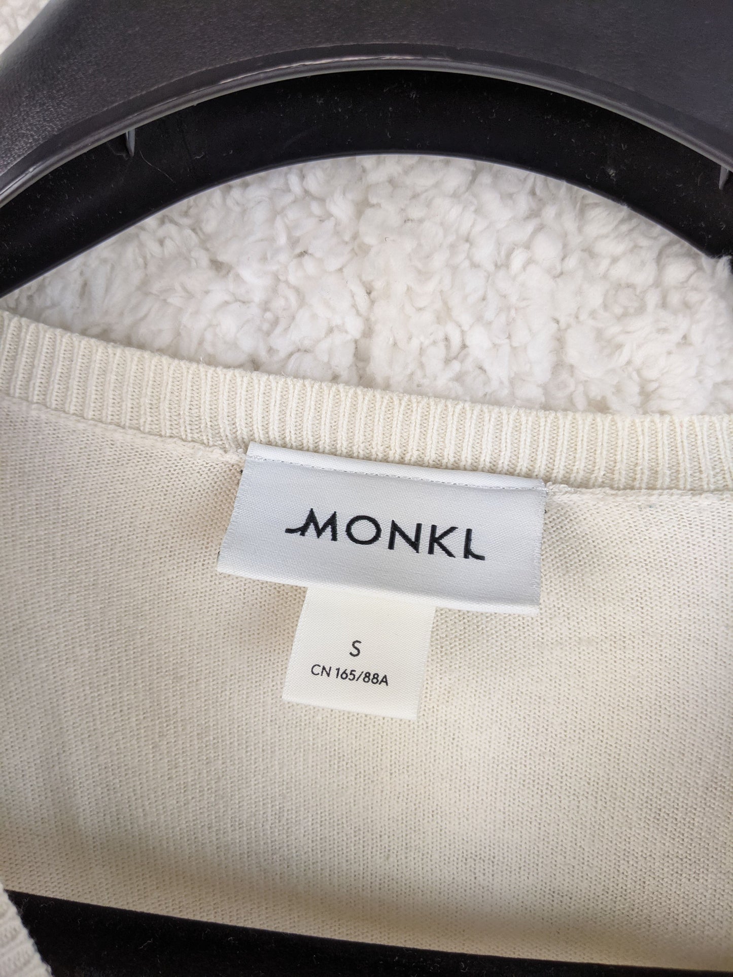 Label showing Monki brand and size S