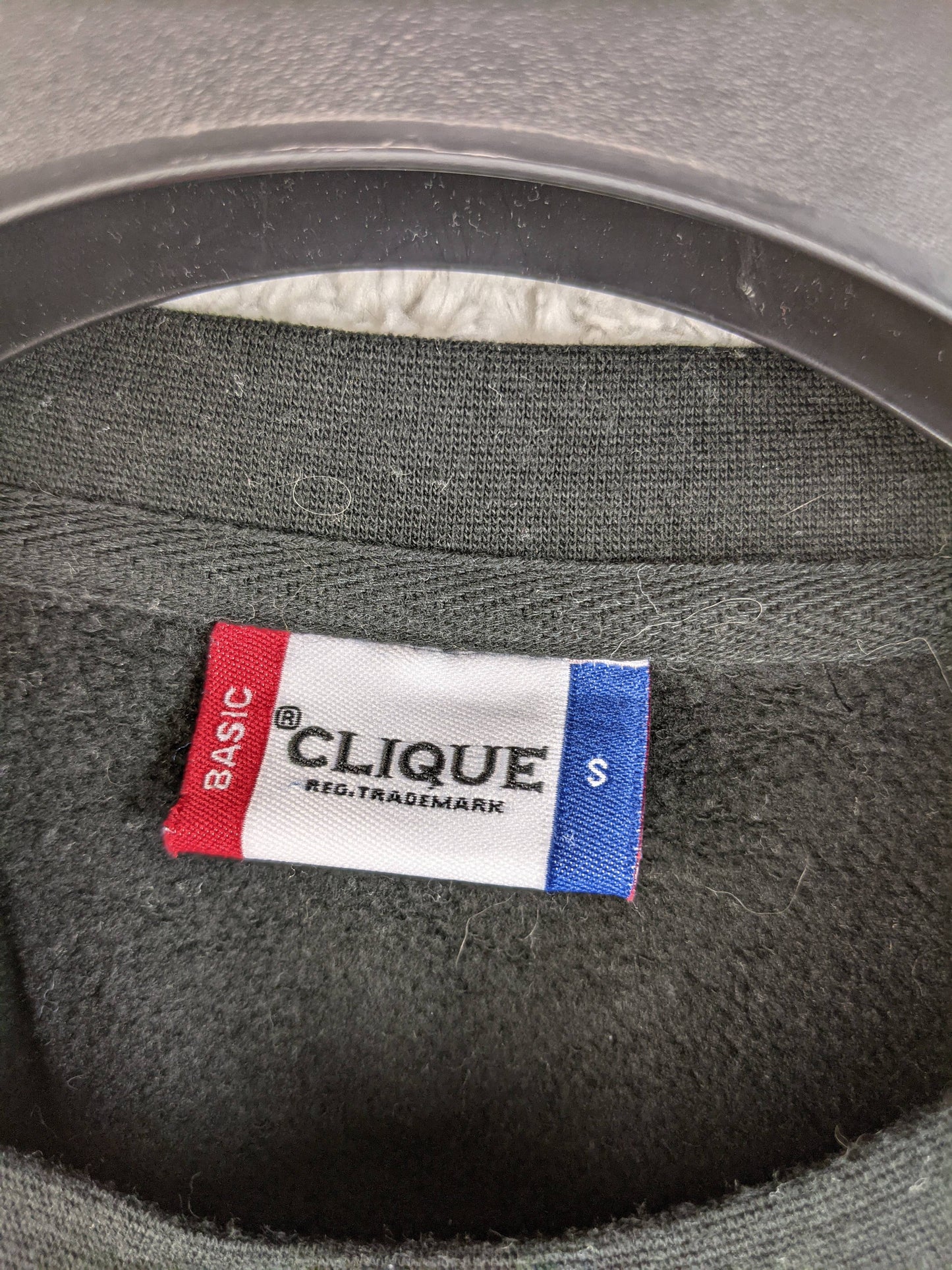 Clique sweatshirt label showing size Small