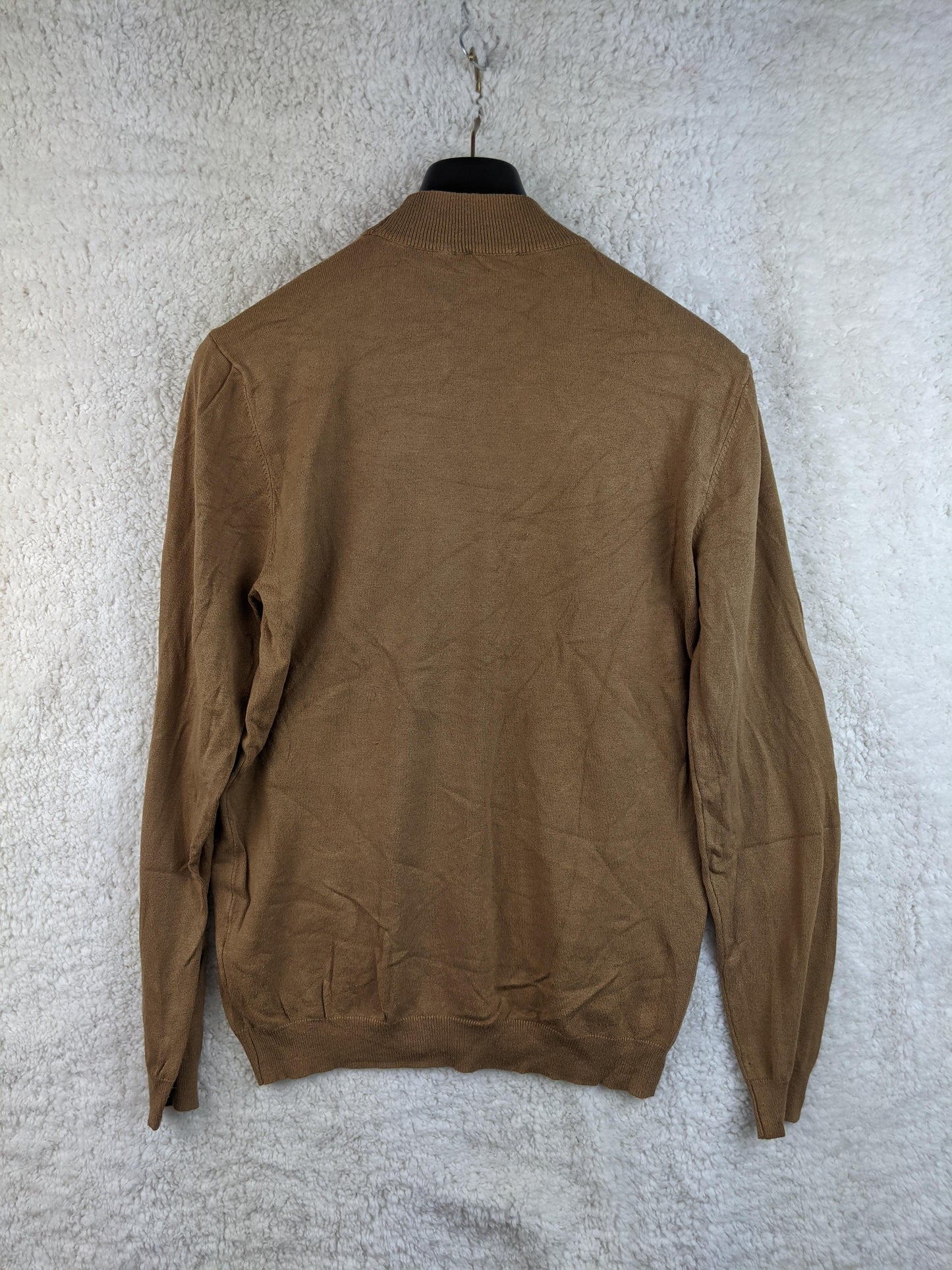 Back view of brown sweater on hanger