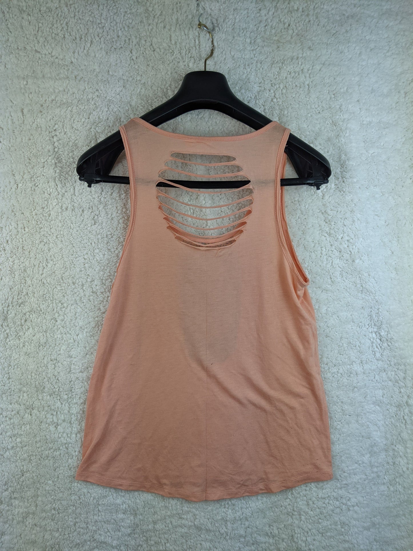 Back view of Rip Curl peach tank top showing cut-out details