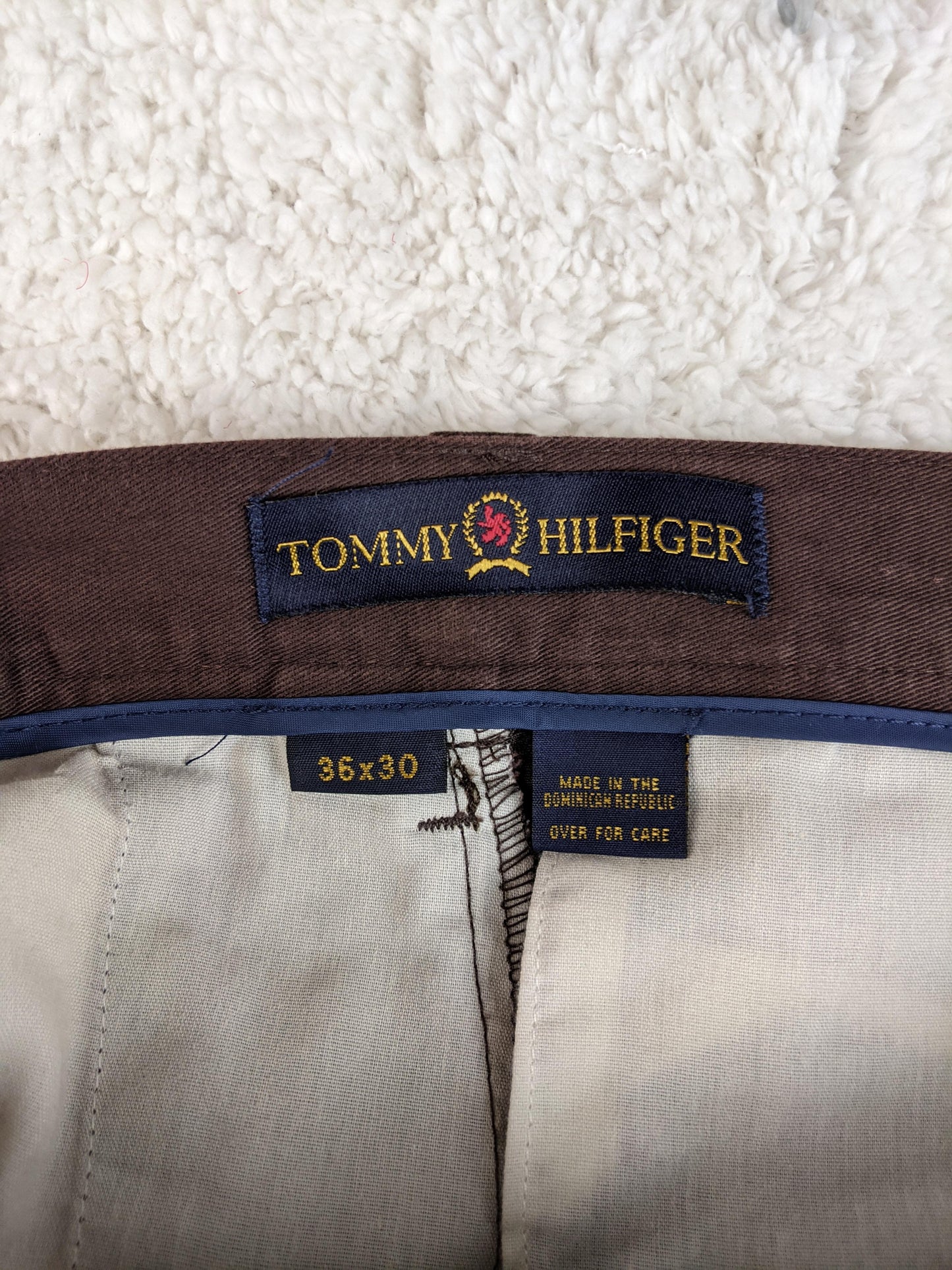 Tommy Hilfiger label on brown pants