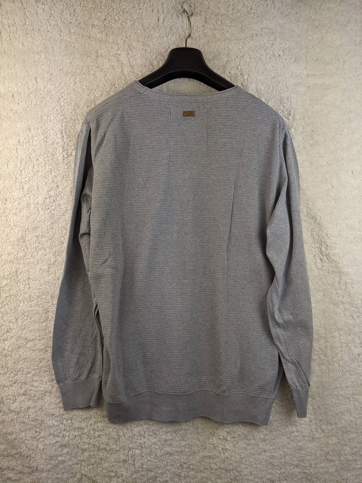 Back view of grey long sleeve sweater